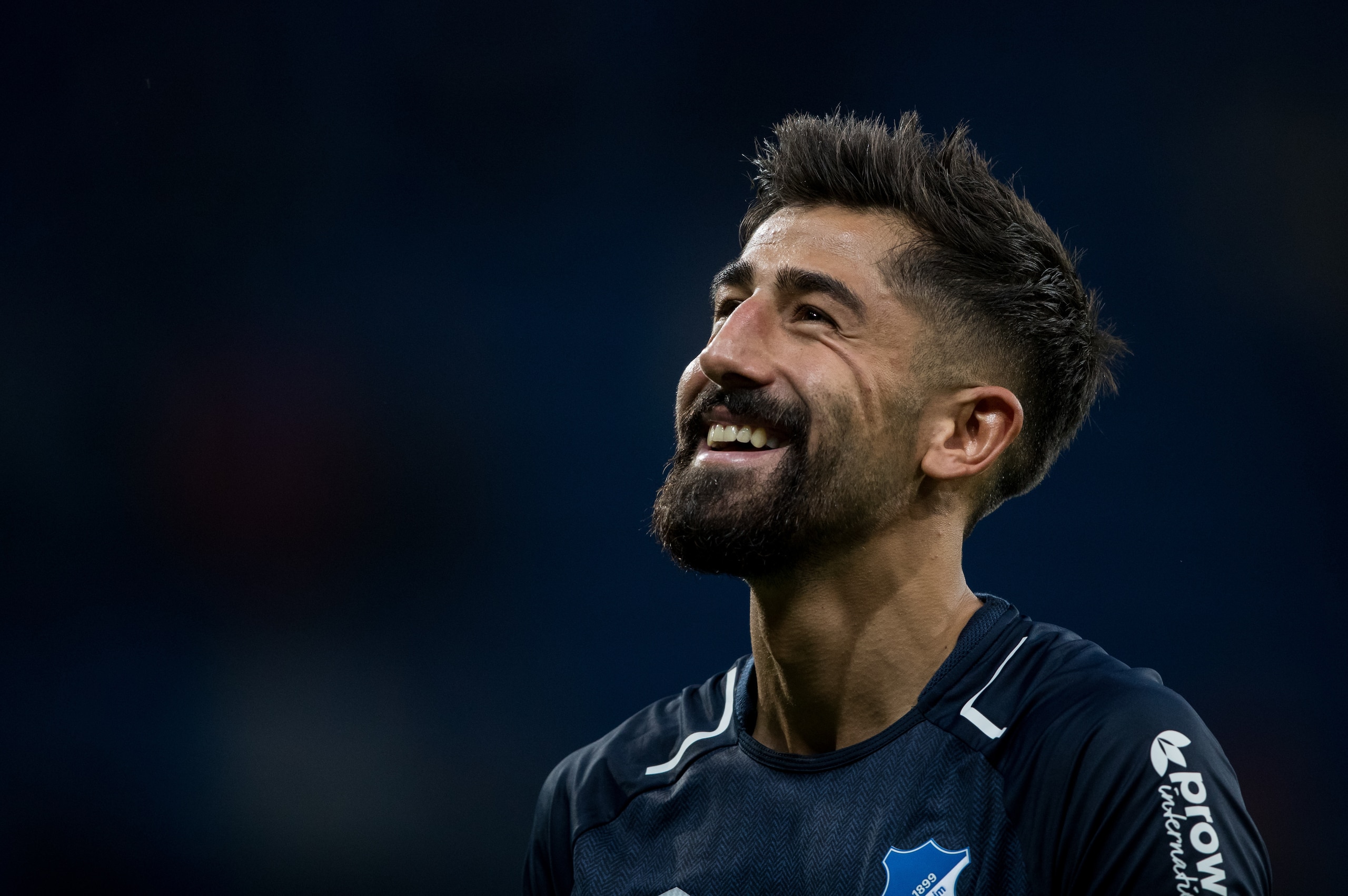 SINSHEIM, GERMANY - SEPTEMBER 09: Kerem Demirbay of Hoffenheim smiles during the Bundesliga match between TSG 1899 Hoffenheim and FC Bayern Muenchen at Wirsol Rhein-Neckar-Arena on September 9, 2017 in Sinsheim, Germany. (Photo by Simon Hofmann/Getty Imag
