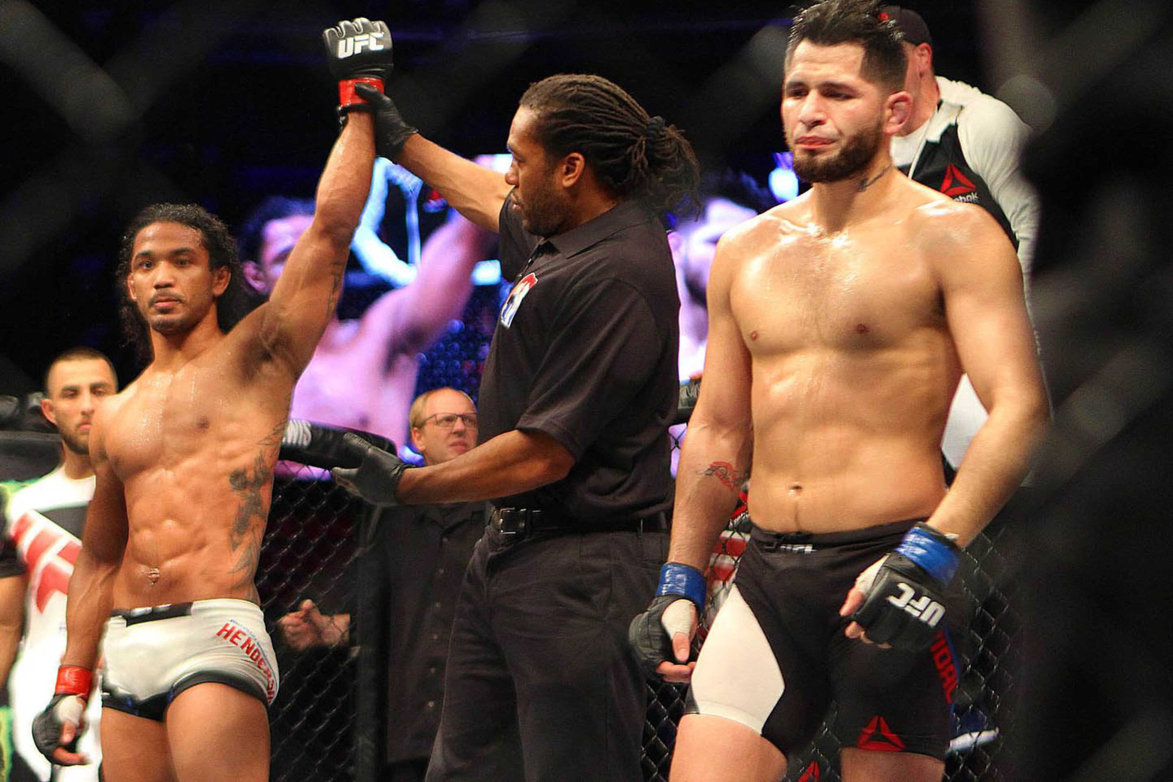 Nov 28, 2015; Seoul, South Korea; Benson Henderson (red gloves) competes against Jorge Masvidal (blue gloves) during UFC Fight Night at Olympic Gymnastics Arena. Mandatory Credit: Lili Troncale-USA TODAY Sports