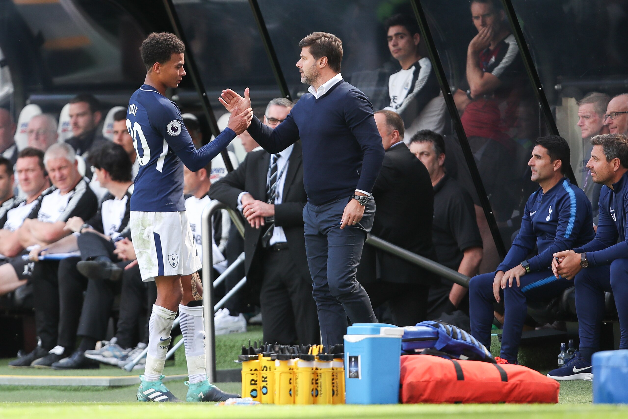 NEWCASTLE UPON TYNE, ENGLAND - AUGUST 13: Dele Alli of Tottenham Hotspur ad Mauricio Pochettino head coach / manager of Tottenham Hotspur during the Premier League match between Newcastle United and Tottenham Hotspur at St. James Park on August 13, 2017 i