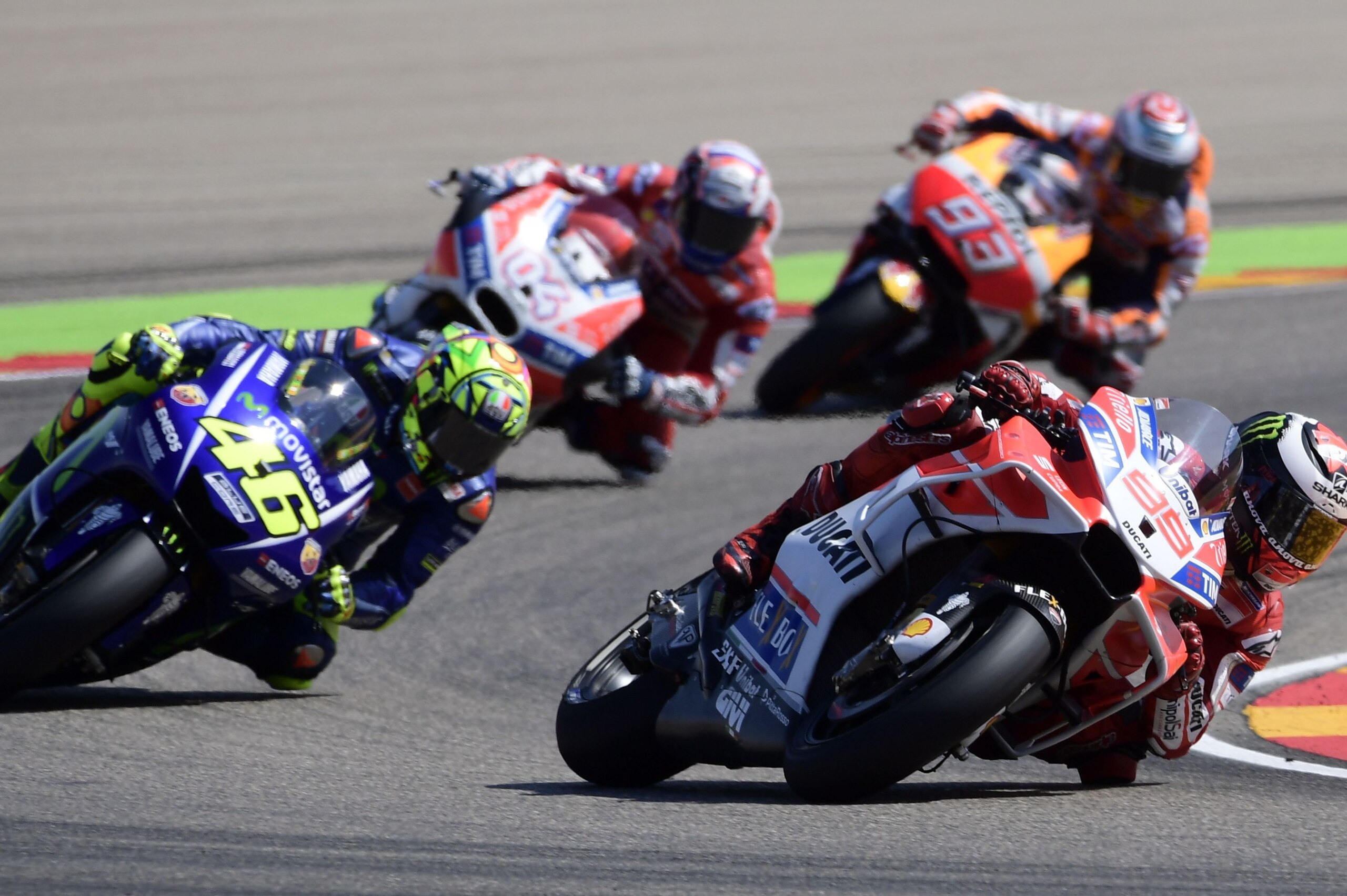 (L-R) Movistar Yamaha MotoGP's Italian rider Valentino Rossi, Ducati Team's Italian rider Andrea Dovizioso, Repsol Honda Team's Spanish rider Marc Marquez and Ducati Team's Spanish rider Jorge Lorenzo ride during MotoGP race of the Moto Grand Prix of Arag