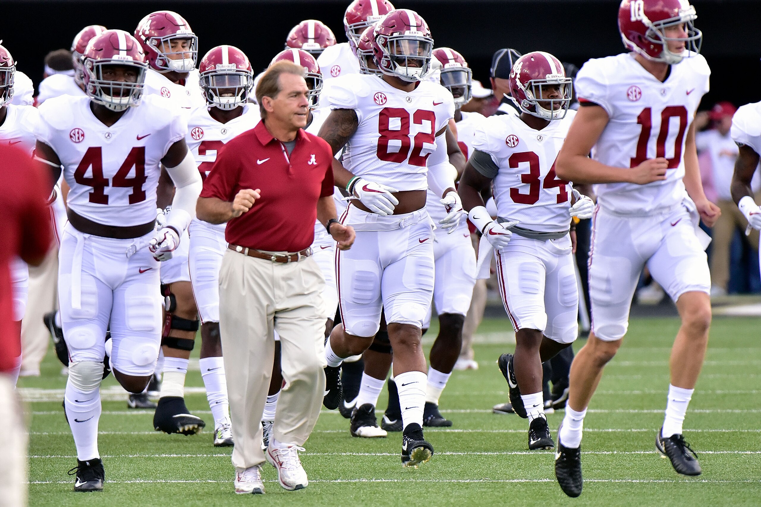 NASHVILLE, TN - SEPTEMBER 23:  Head coach Nick Saban of the Alabama Crimson Tide runs onto the field with his team prior to a game against the Vanderbilt Commodores during the first half at Vanderbilt Stadium on September 23, 2017 in Nashville, Tennessee.