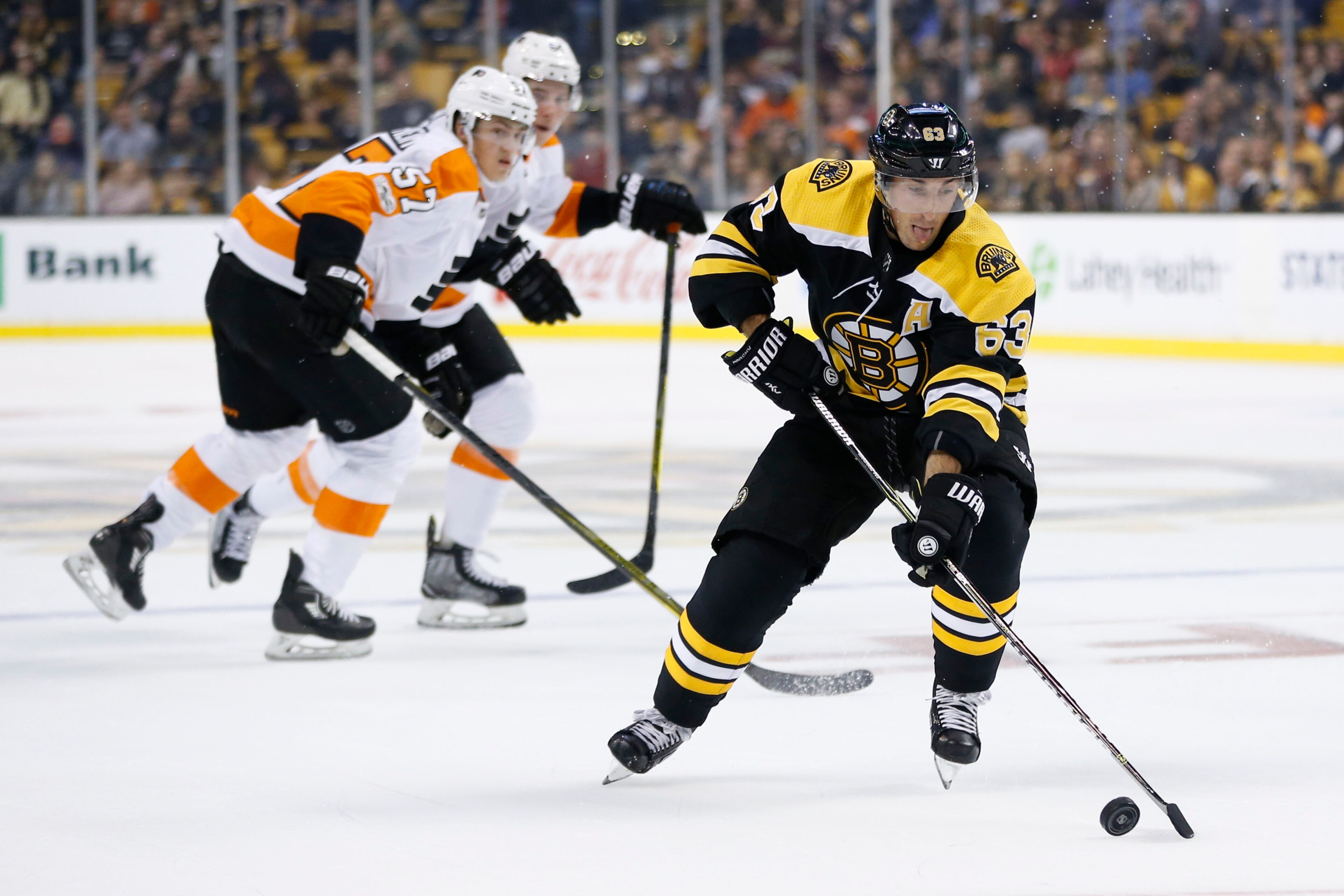 Sep 21, 2017; Boston, MA, USA; Boston Bruins left wing Brad Marchand (63) controls the puck during the first period against the Philadelphia Flyers at TD Garden. Mandatory Credit: Greg M. Cooper-USA TODAY Sports