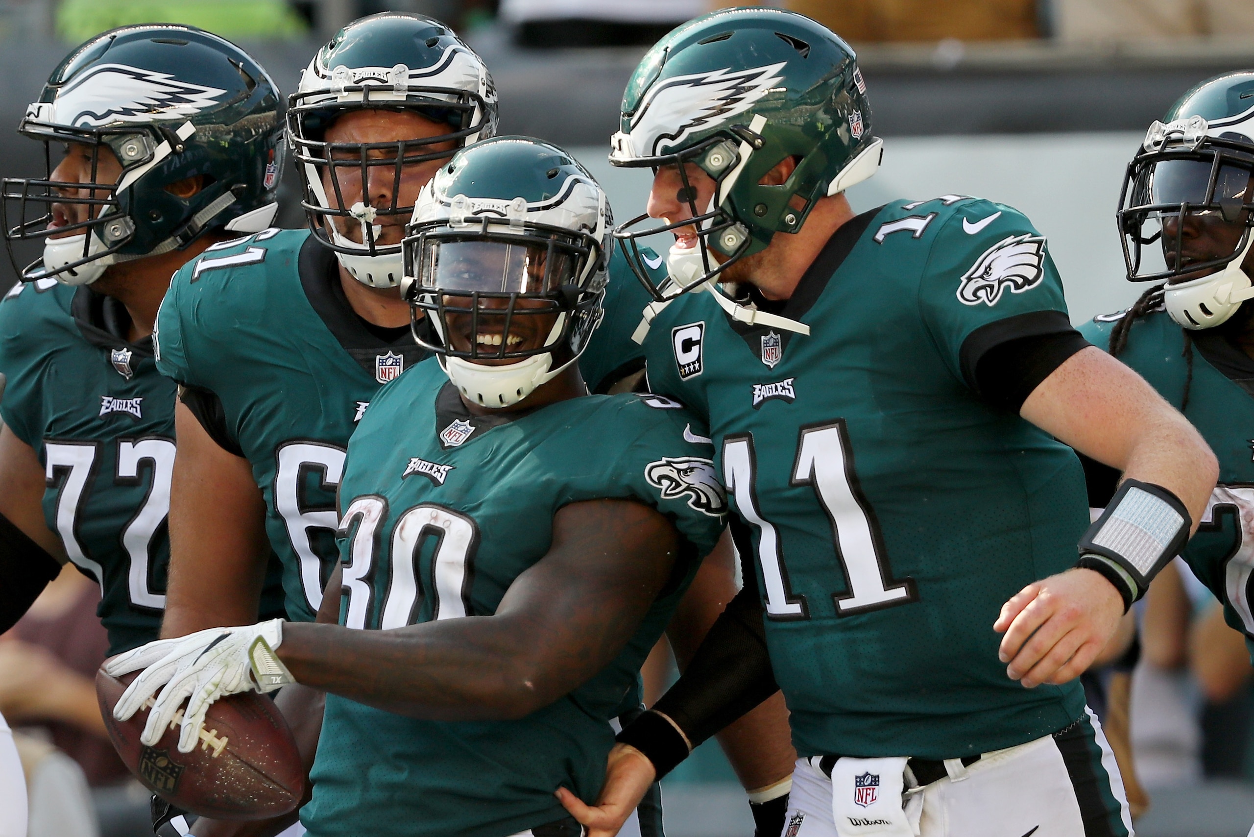 PHILADELPHIA, PA - SEPTEMBER 24:  Corey Clement #30 of the Philadelphia Eagles is congratulated by teammate  Carson Wentz #11 after Clement scored in the fourth quarter against the New York Giants on September 24, 2017  at Lincoln Financial Field in Phila