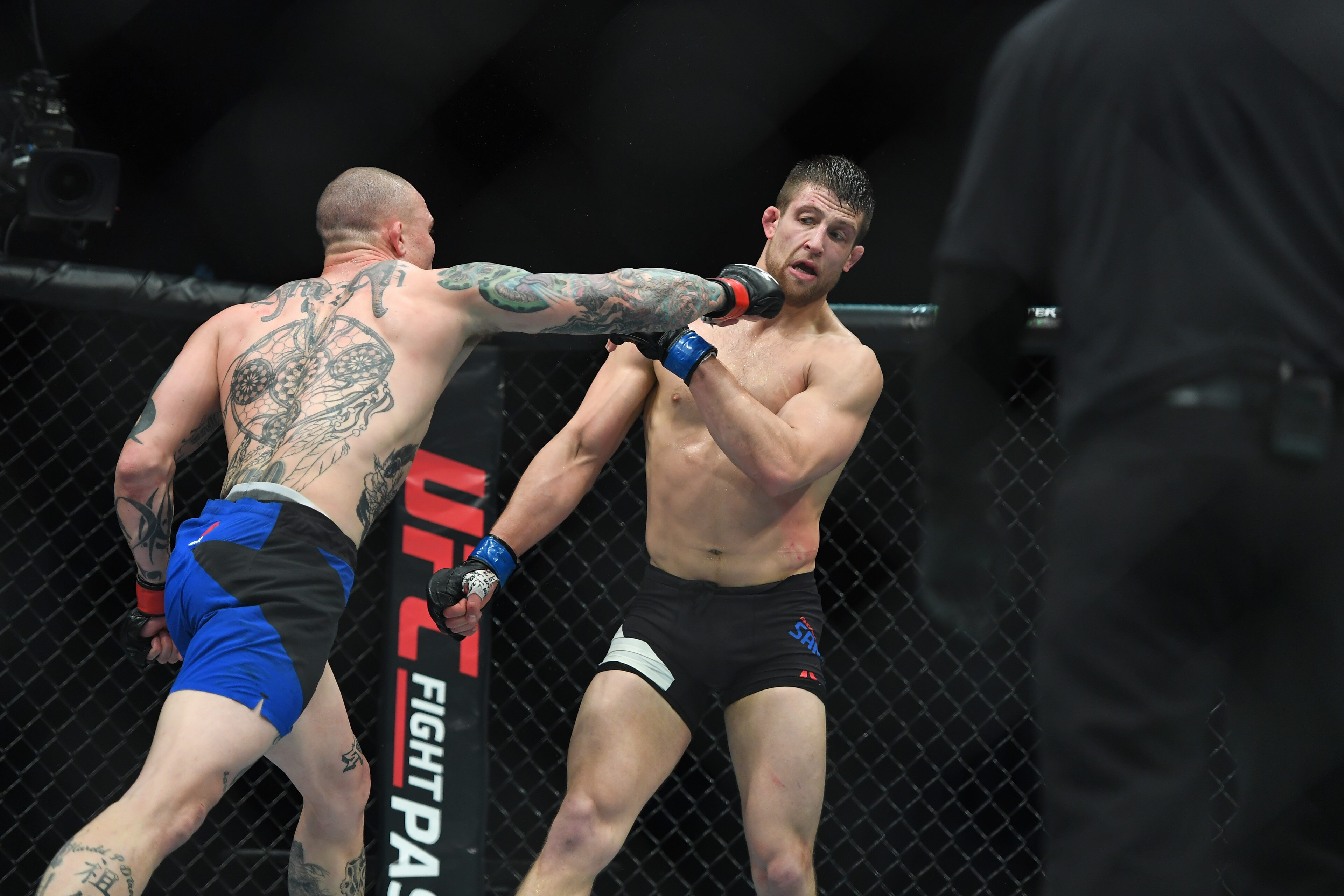 Apr 15, 2017; Kansas City, MO, USA; Anthony Smith (Red Gloves) fights Andrew Sanchez (Blue Gloves) during UFC Fight Night at the Sprint Center. Mandatory Credit: Ron Chenoy-USA TODAY Sports