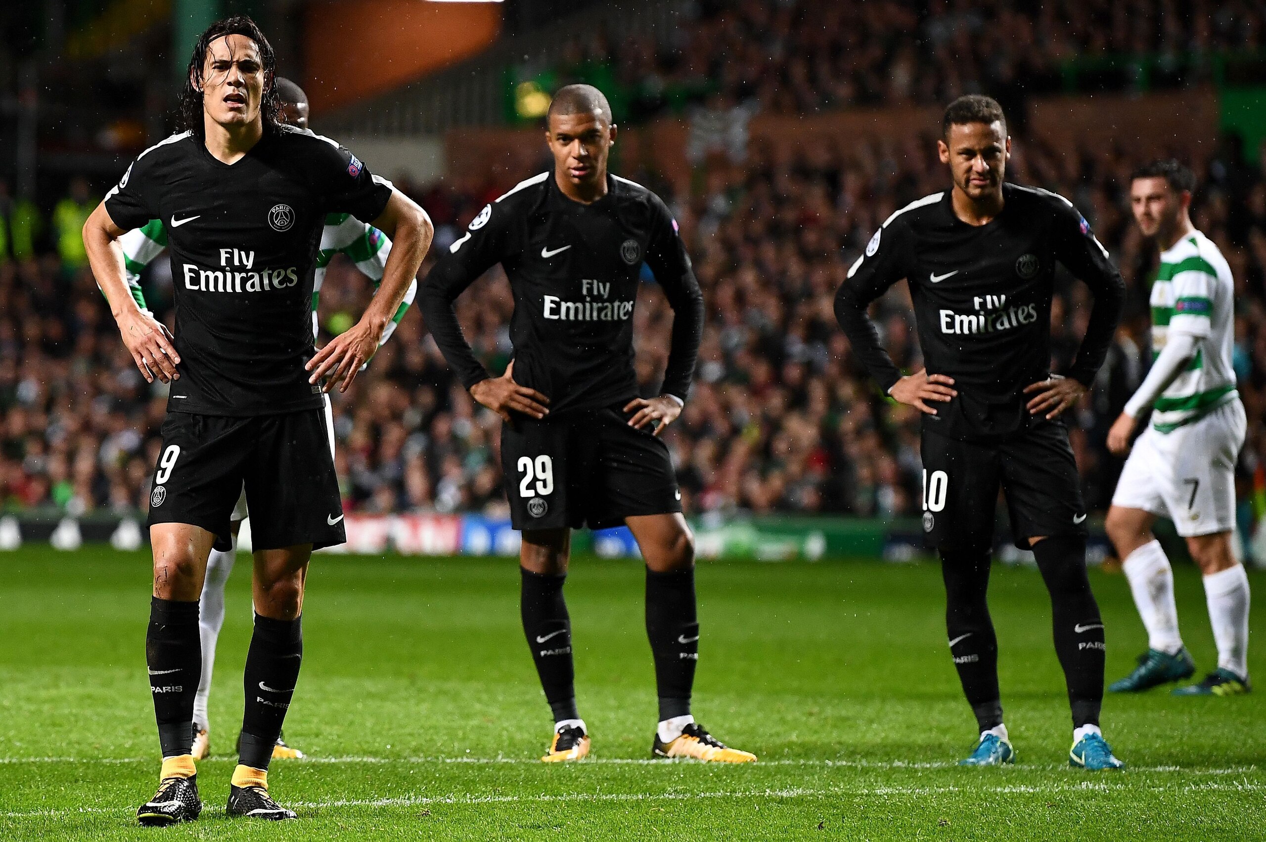 Paris Saint-Germain's Uruguayan striker Edinson Cavani (L), Paris Saint-Germain's French striker Kylian Mbappe (C) and Paris Saint-Germain's Brazilian striker Neymar gesture during the UEFA Champions League Group B football match between Celtic and Paris 