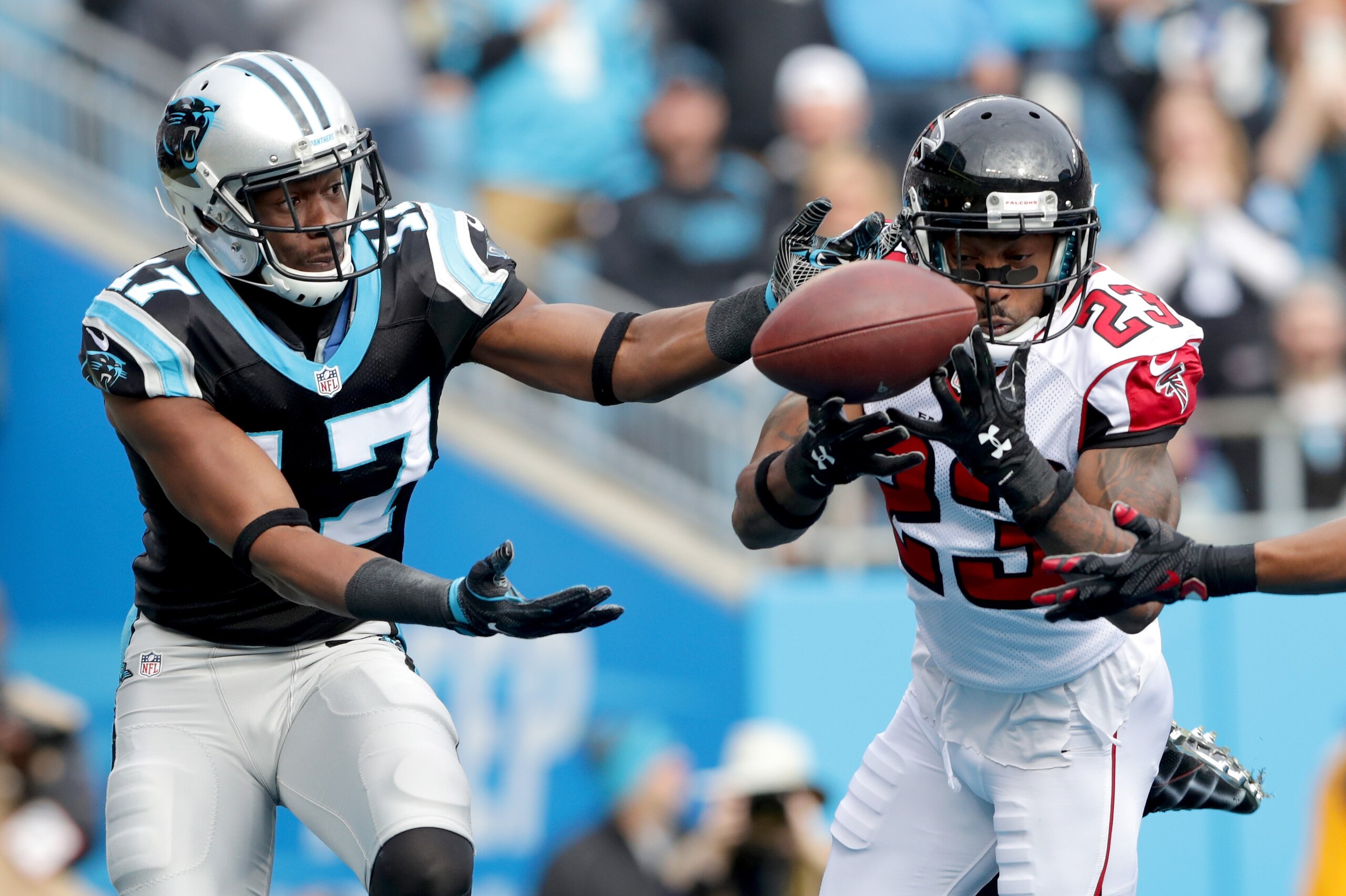 CHARLOTTE, NC - DECEMBER 24:  Devin Funchess #17 of the Carolina Panthers and  Robert Alford #23 of the Atlanta Falcons compete for a tipped ball in the 2nd quarter during their game at Bank of America Stadium on December 24, 2016 in Charlotte, North Caro