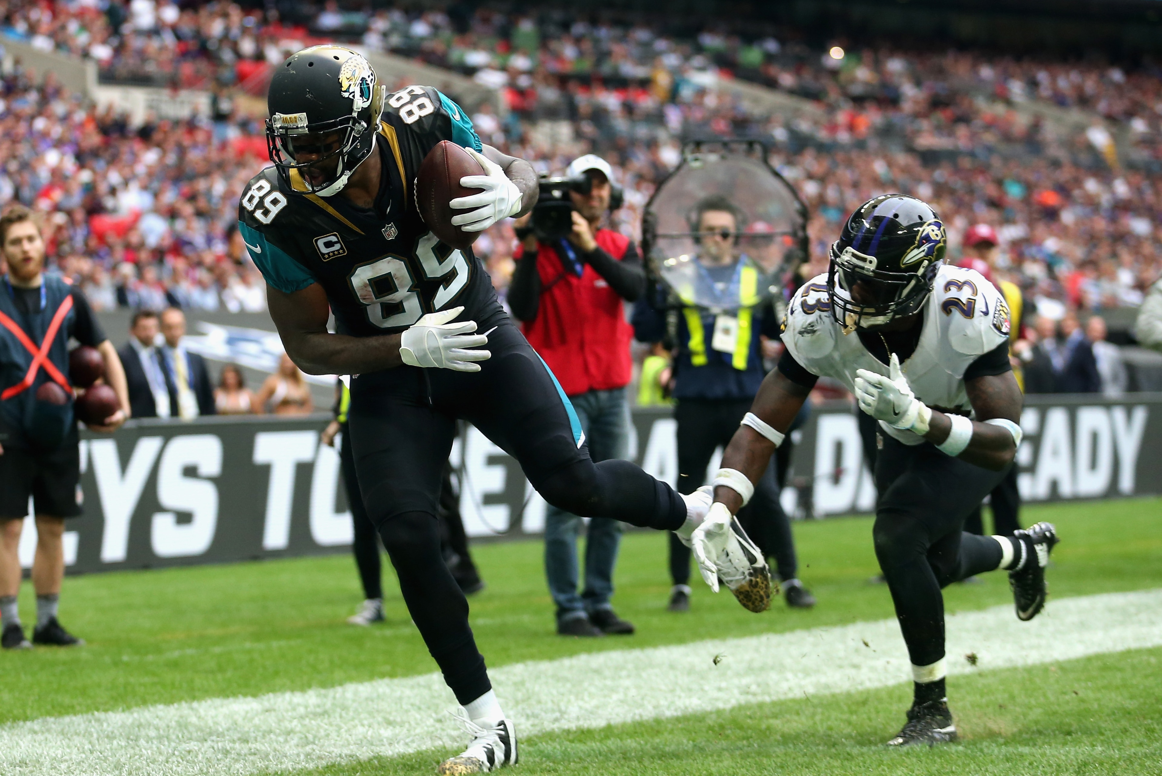 LONDON, ENGLAND - SEPTEMBER 24: Marcedes Lewis of the Jacksonville Jaguars scores a touchdown under pressure from Tony Jefferson of the Baltimore Ravens during the NFL International Series match between Baltimore Ravens and Jacksonville Jaguars at Wembl LONDON, ENGLAND - SEPTEMBER 24: Marcedes Lewis of the Jacksonville Jaguars scores a touchdown under pressure from Tony Jefferson of the Baltimore Ravens during the NFL International Series match between Baltimore Ravens and Jacksonville Jaguars at Wembl
