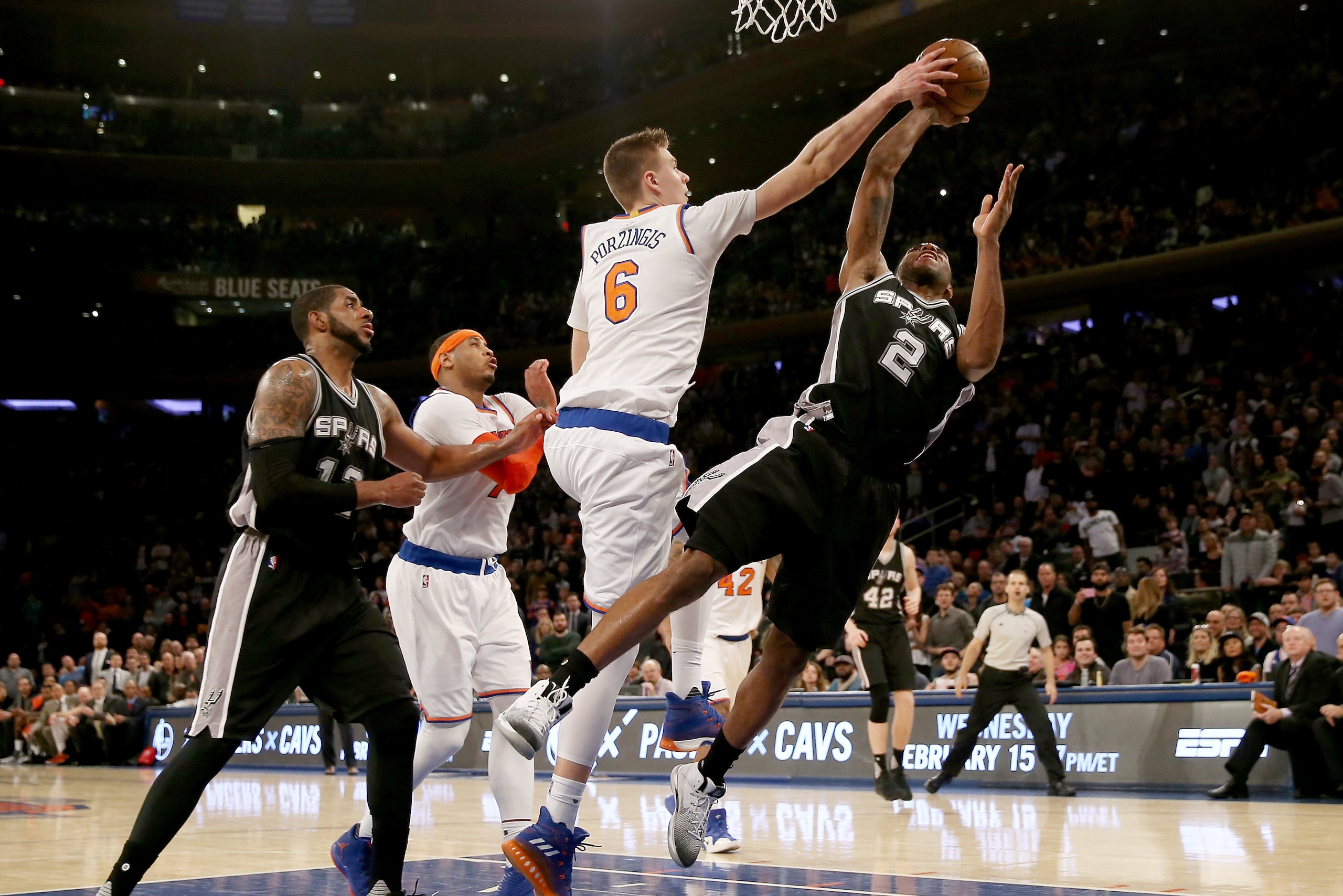NEW YORK, NY - FEBRUARY 12:  Kristaps Porzingis #6 of the New York Knicks blocks a shot by Kawhi Leonard #2 of the San Antonio Spurs in the fourth quarter at Madison Square Garden on February 12, 2017 in New York City. NOTE TO USER: User expressly acknowl