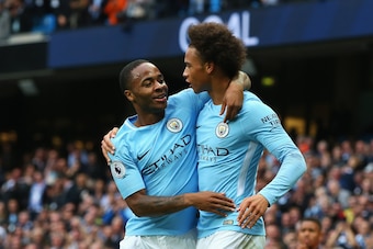 MANCHESTER, ENGLAND - SEPTEMBER 23:  Raheem Sterling (L) of Manchester City celebrates scoring his sides second goal with his team mate Leroy Sane (R) during the Premier League match between Manchester City and Crystal Palace at Etihad Stadium on Septembe