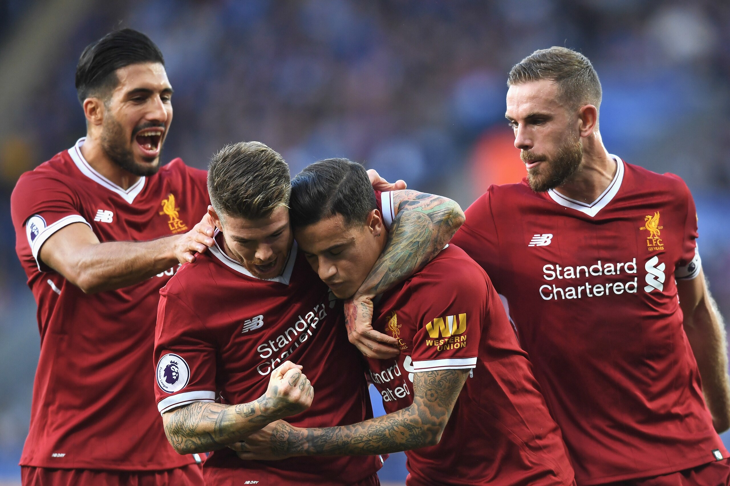 LEICESTER, ENGLAND - SEPTEMBER 23:  Philippe Coutinho of Liverpool celebrates with team mates after scoring his sides first goal during the Premier League match between Leicester City and Liverpool at The King Power Stadium on September 23, 2017 in Leices