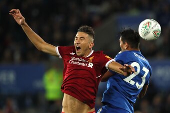 LEICESTER, ENGLAND - SEPTEMBER 19:  Marko Grujic of Liverpool competes with Leonardo Ulloa of Leicester City during the Carabao Cup third round match between Leicester City and Liverpool at The King Power Stadium on September 19, 2017 in Leicester, Englan