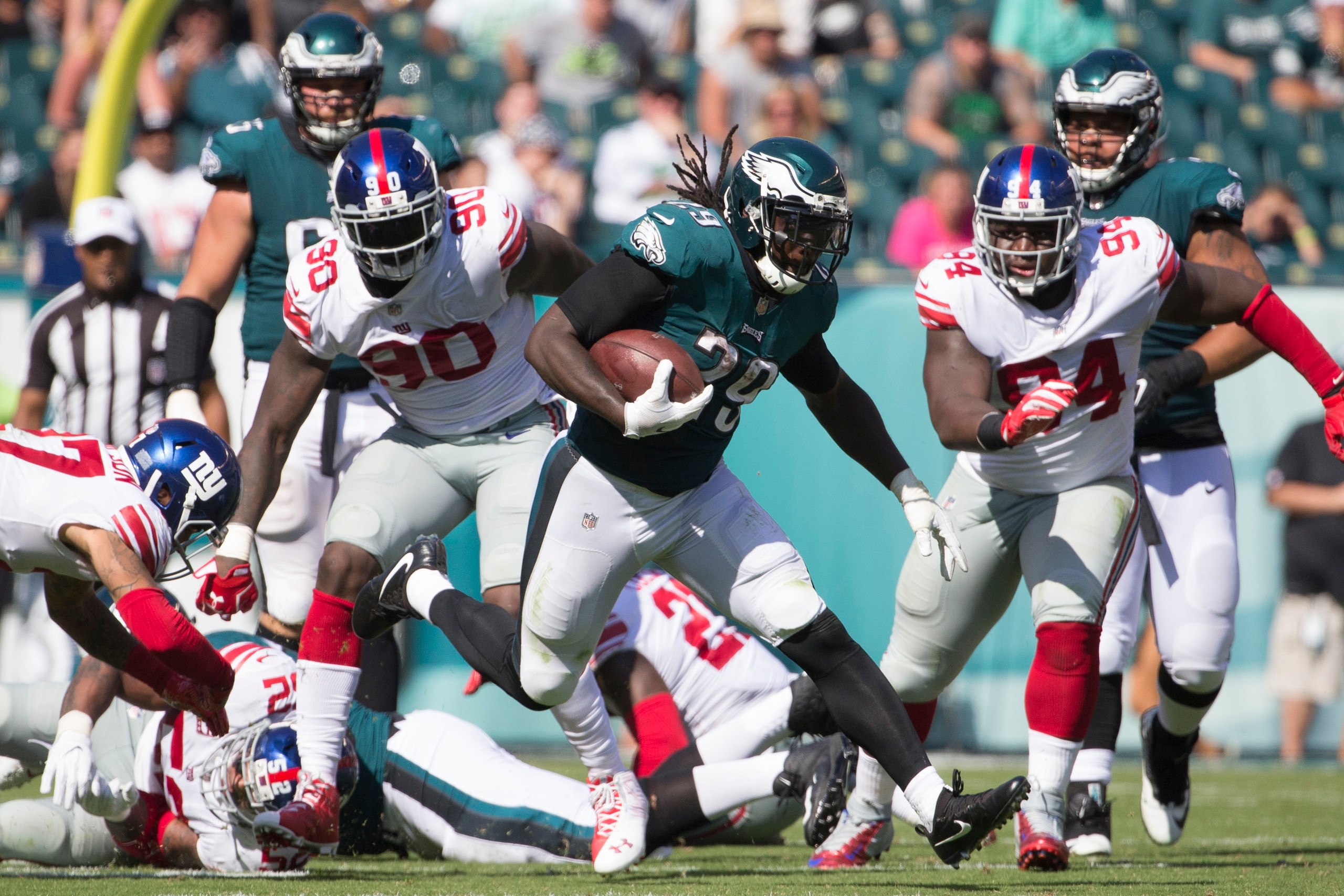 PHILADELPHIA, PA - SEPTEMBER 24: LeGarrette Blount #29 of the Philadelphia Eagles runs the ball against Jason Pierre-Paul #90 and Dalvin Tomlinson #94 of the New York Giants in the third quarter at Lincoln Financial Field on September 24, 2017 in Philadel PHILADELPHIA, PA - SEPTEMBER 24: LeGarrette Blount #29 of the Philadelphia Eagles runs the ball against Jason Pierre-Paul #90 and Dalvin Tomlinson #94 of the New York Giants in the third quarter at Lincoln Financial Field on September 24, 2017 in Philadel