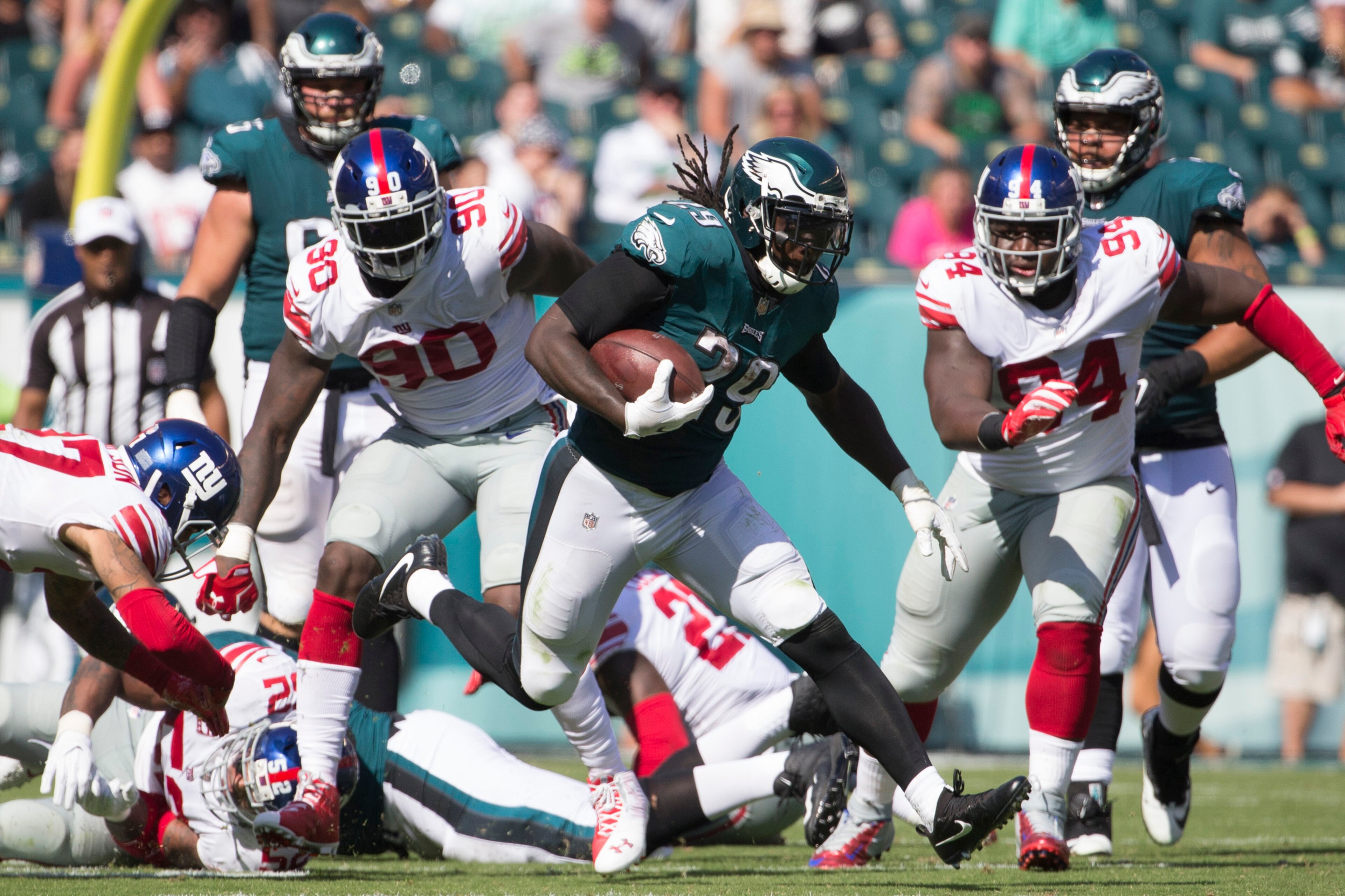 PHILADELPHIA, PA - SEPTEMBER 24: LeGarrette Blount #29 of the Philadelphia Eagles runs the ball against Jason Pierre-Paul #90 and Dalvin Tomlinson #94 of the New York Giants in the third quarter at Lincoln Financial Field on September 24, 2017 in Philadel