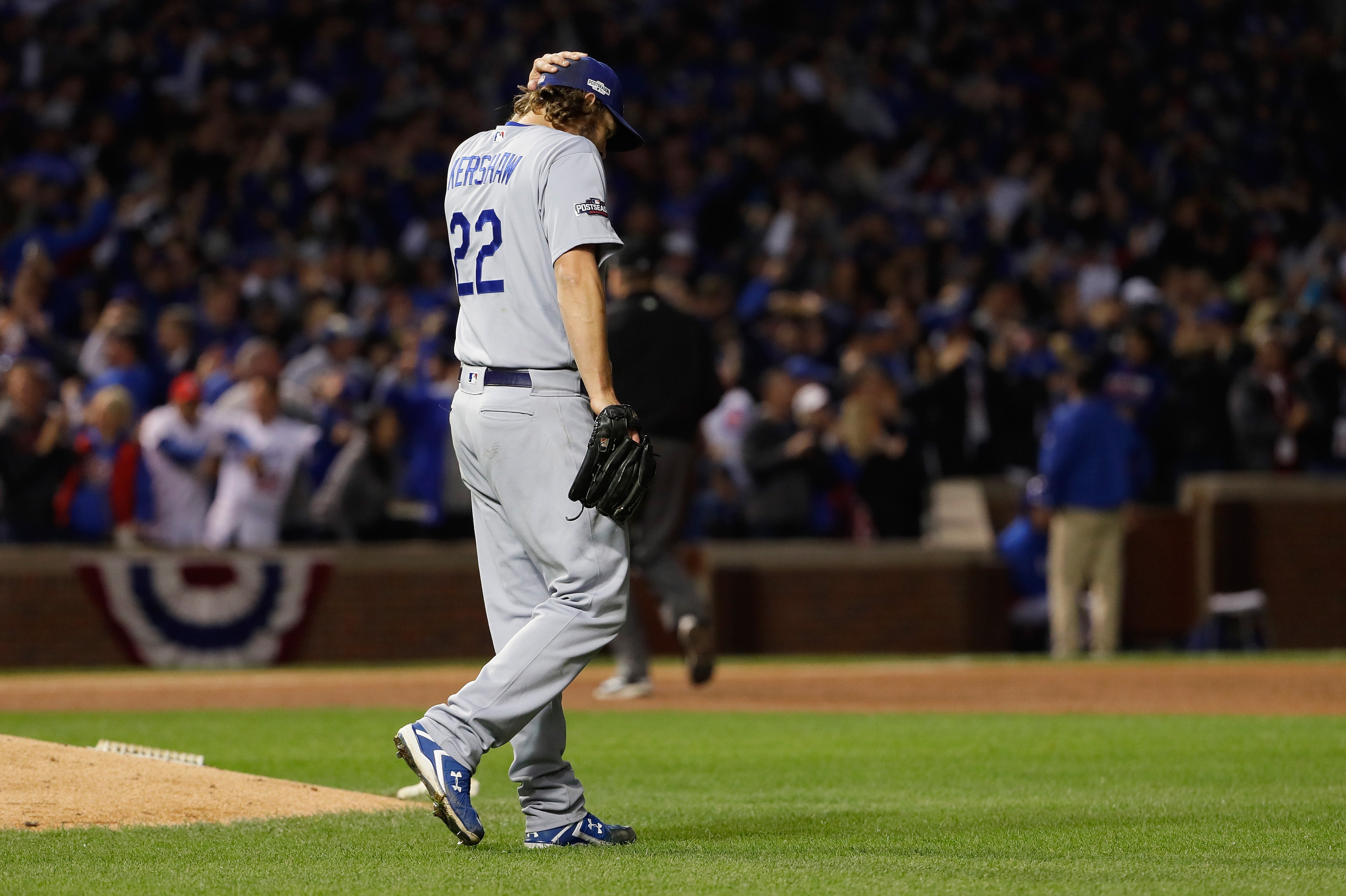 CHICAGO, IL - OCTOBER 22:  Clayton Kershaw #22 of the Los Angeles Dodgers reacts after a solo home run by Anthony Rizzo #44 of the Chicago Cubs (not pictured) in the fifth inning during game six of the National League Championship Series at Wrigley Field 