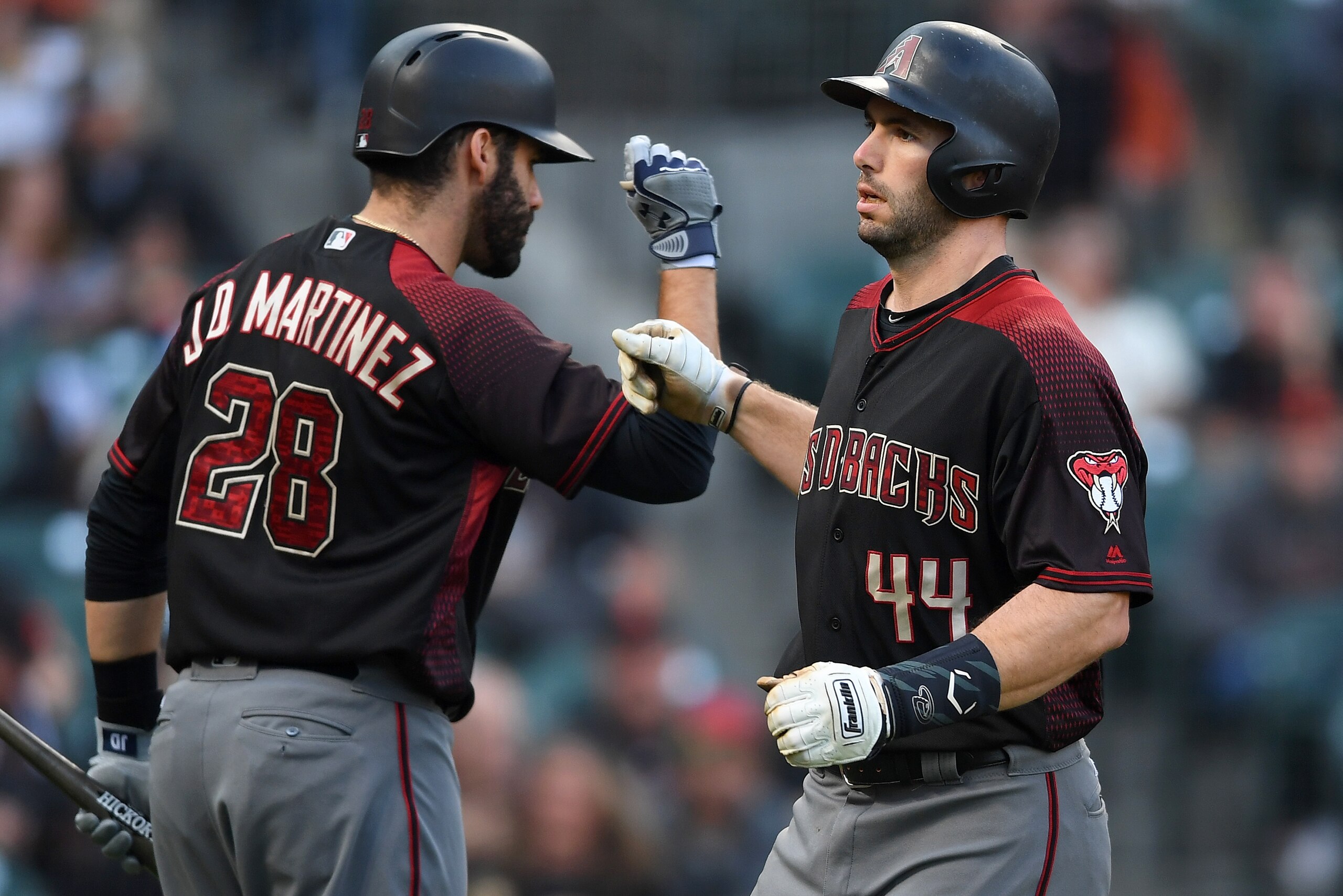 SAN FRANCISCO, CA - SEPTEMBER 16: Paul Goldschmidt #44 of the Arizona Diamondbacks is congratulated J.D. Martinez #28 after Goldschmidt hit a two-run homer against the San Francisco Giants in the top of the first inning at AT&T Park on September 16, 2017 SAN FRANCISCO, CA - SEPTEMBER 16: Paul Goldschmidt #44 of the Arizona Diamondbacks is congratulated J.D. Martinez #28 after Goldschmidt hit a two-run homer against the San Francisco Giants in the top of the first inning at AT&T Park on September 16, 2017