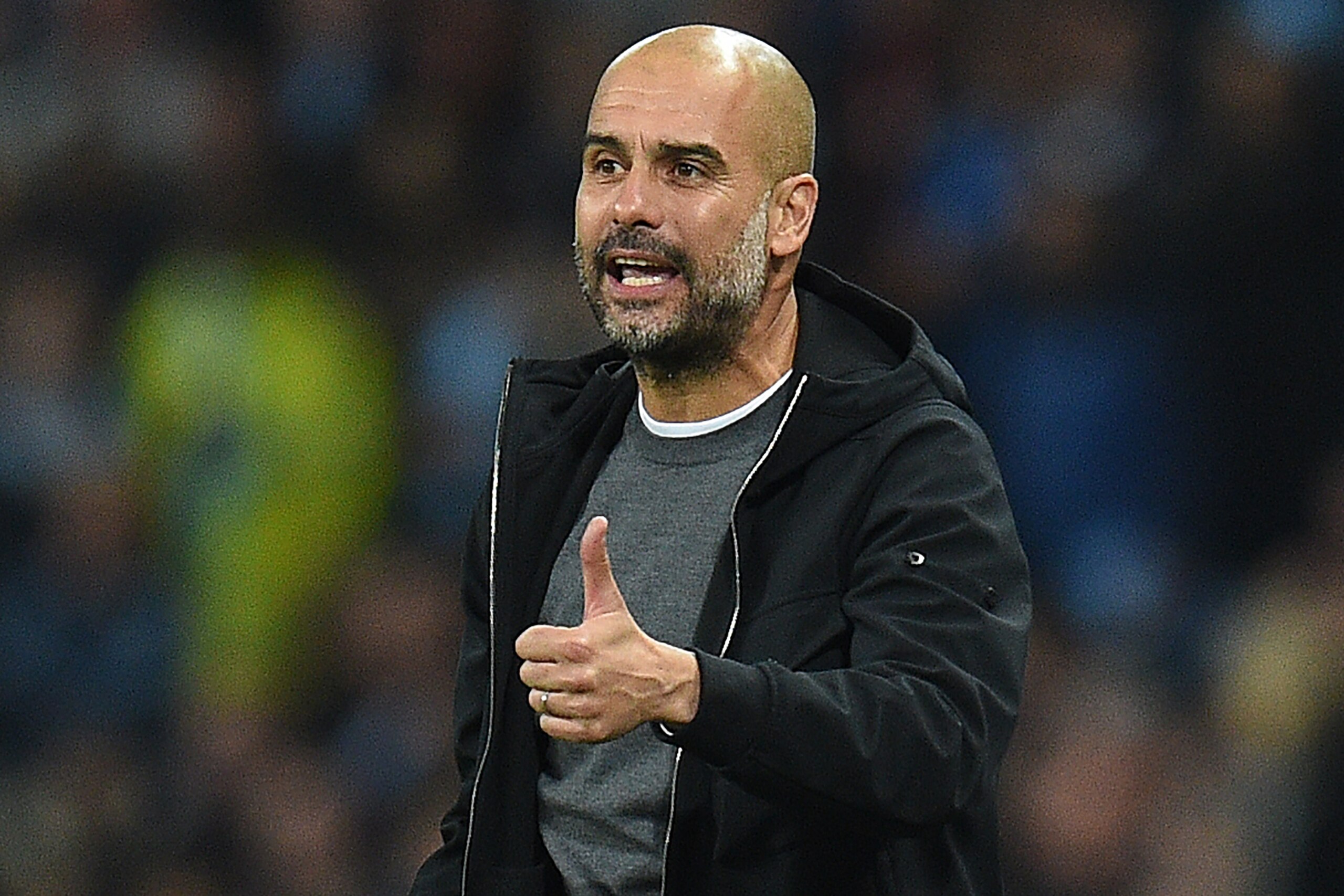 Manchester City's Spanish manager Pep Guardiola shouts instructions to his players from the touchline during the Group F football match between Manchester City and Shakhtar Donetsk at the Etihad Stadium in Manchester, north west England, on September 26, 