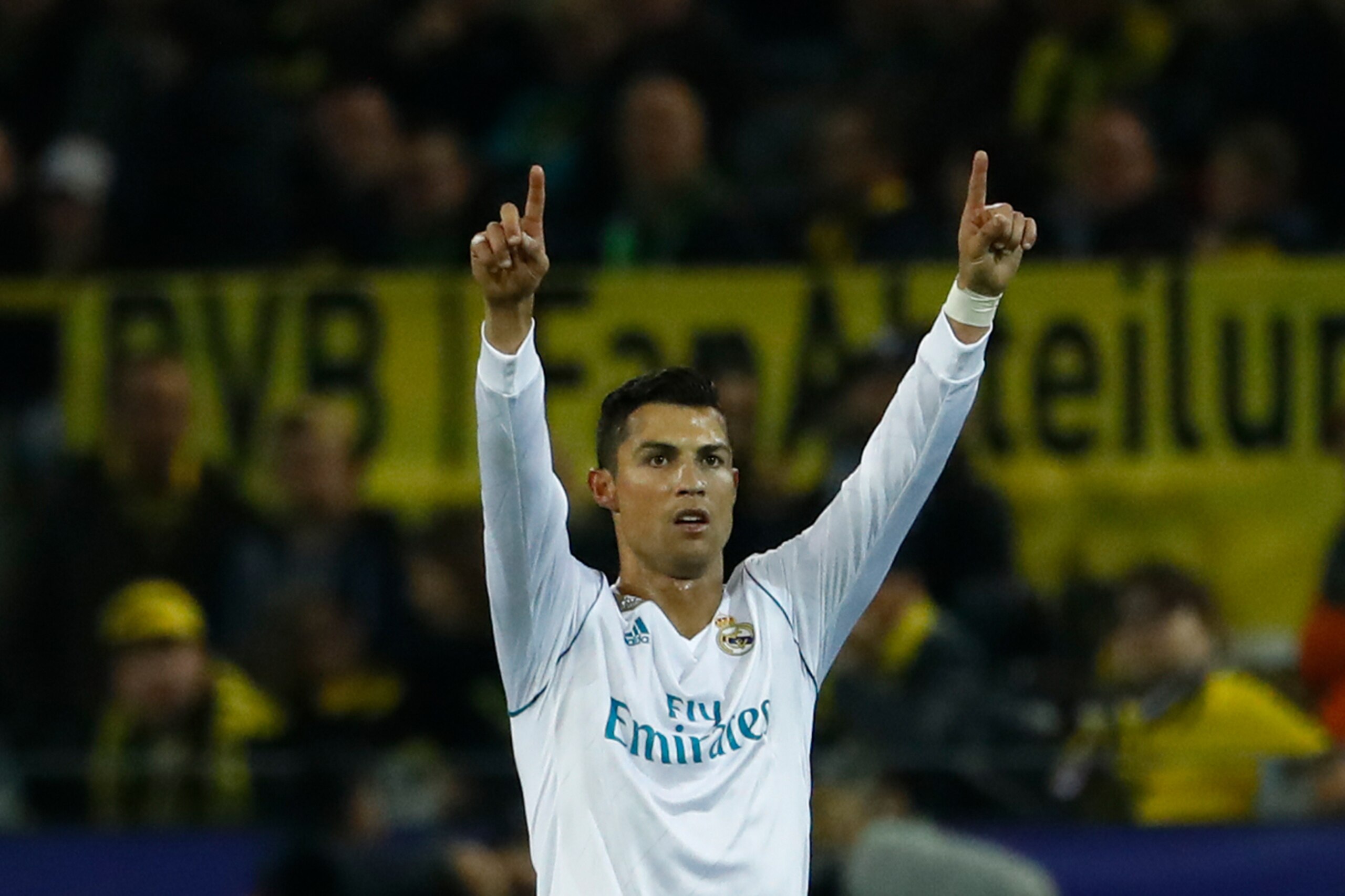 Real Madrid's forward from Portugal Cristiano Ronaldo celebrates scoring during the UEFA Champions League Group H football match BVB Borussia Dortmund v Real Madrid in Dortmund, western Germany on September 26, 2017. / AFP PHOTO / Odd ANDERSEN        (Pho