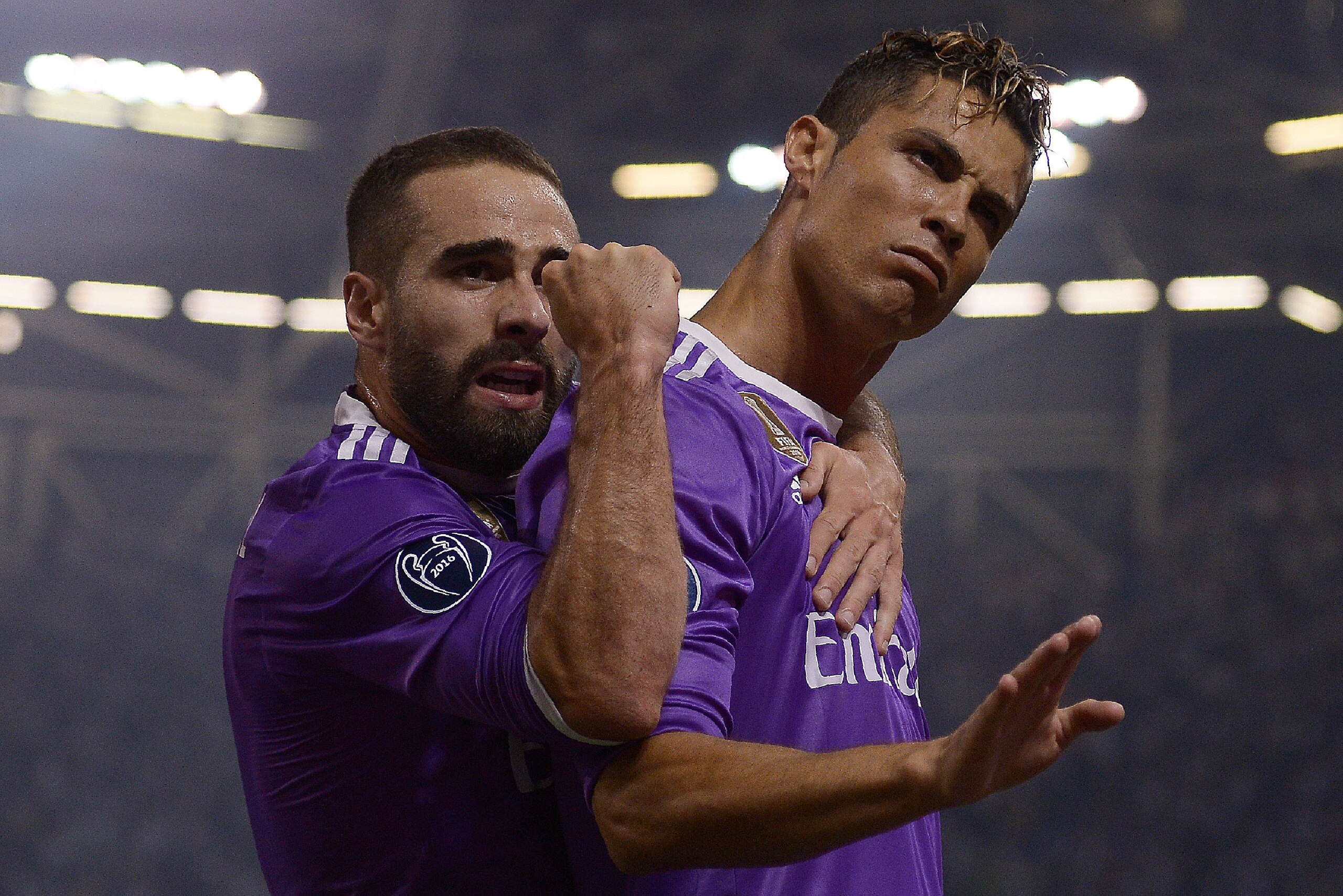 TOPSHOT - Real Madrid's Portuguese striker Cristiano Ronaldo (R) celebrates with Real Madrid's Spanish defender Dani Carvajal after scoring during the UEFA Champions League final football match between Juventus and Real Madrid at The Principality Stadium 