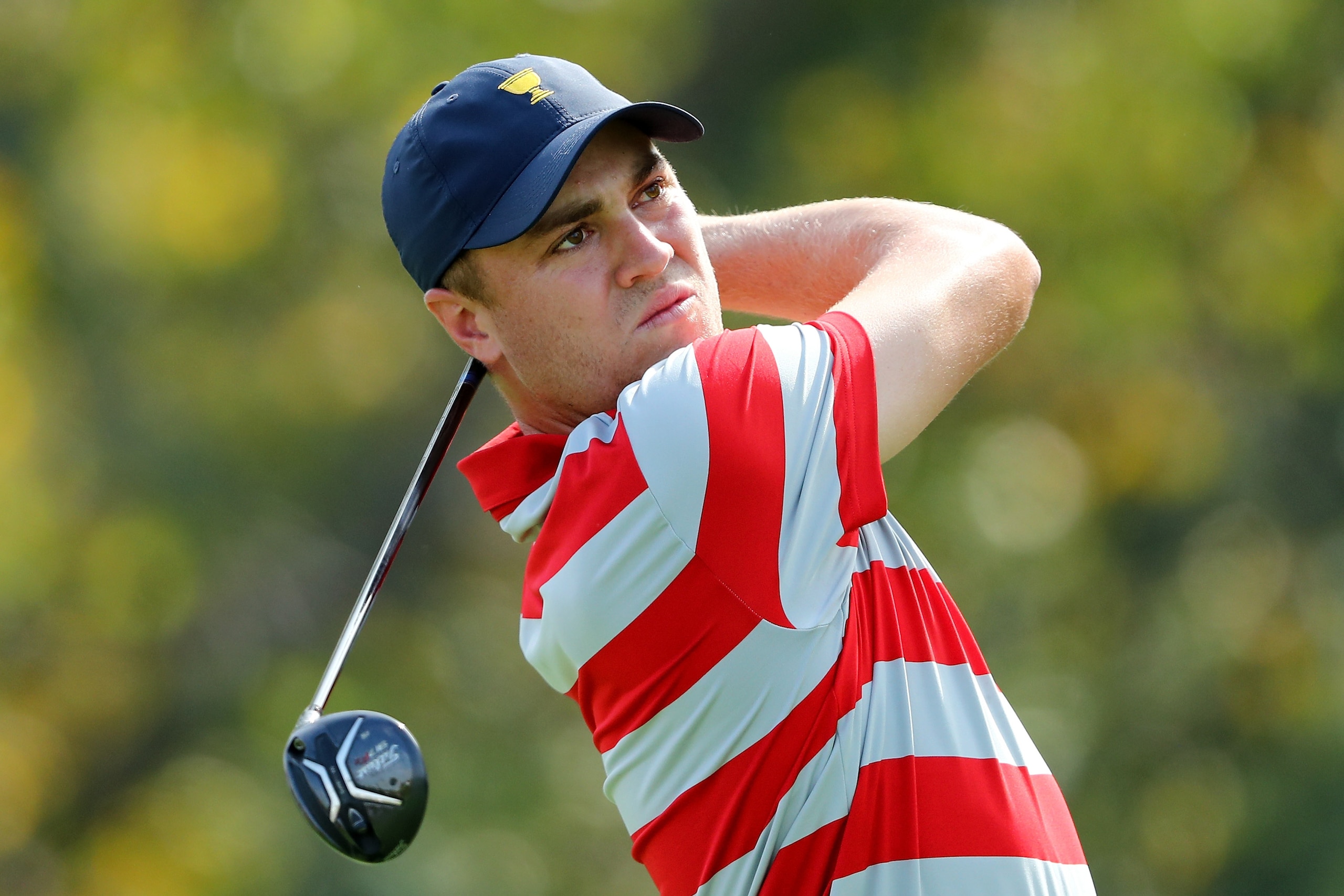 JERSEY CITY, NJ - SEPTEMBER 26: Justin Thomas of the United States tees off during a practice round prior to the Presidents Cup on September 26, 2017 at Liberty National Golf Club in Jersey City, New Jersey. (Photo by Elsa/Getty Images) JERSEY CITY, NJ - SEPTEMBER 26: Justin Thomas of the United States tees off during a practice round prior to the Presidents Cup on September 26, 2017 at Liberty National Golf Club in Jersey City, New Jersey. (Photo by Elsa/Getty Images)