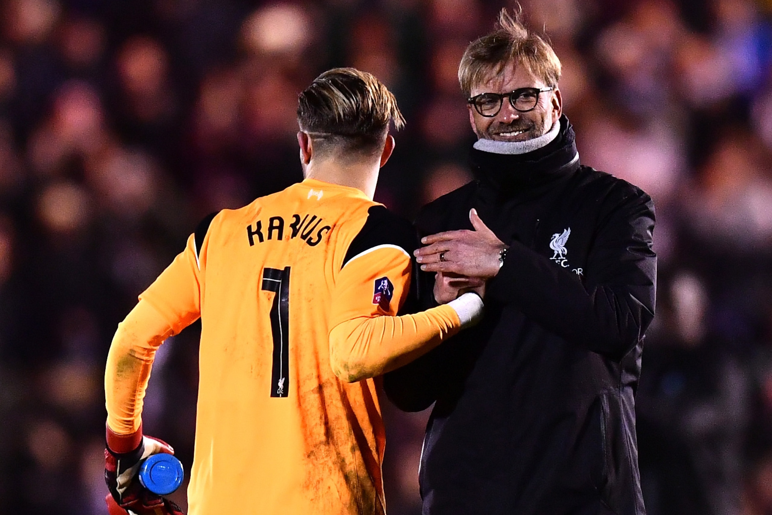 PLYMOUTH, ENGLAND - JANUARY 18: Jurgen Klopp, Manager of Liverpool celebrates with Loris Karius after the Emirates FA Cup Third Round Replay match between Plymouth Argyle and Liverpool at Home Park on January 18, 2017 in Plymouth, England. (Photo by Dan PLYMOUTH, ENGLAND - JANUARY 18: Jurgen Klopp, Manager of Liverpool celebrates with Loris Karius after the Emirates FA Cup Third Round Replay match between Plymouth Argyle and Liverpool at Home Park on January 18, 2017 in Plymouth, England. (Photo by Dan