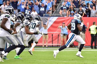NASHVILLE, TN - SEPTEMBER 24:  DeMarco Murray #29 of the Tennessee Titans runs past a group of the Seattle Seahawks for a touchdown during the second half at Nissan Stadium on September 24, 2017 in Nashville, Tennessee.  (Photo by Frederick Breedon/Getty 