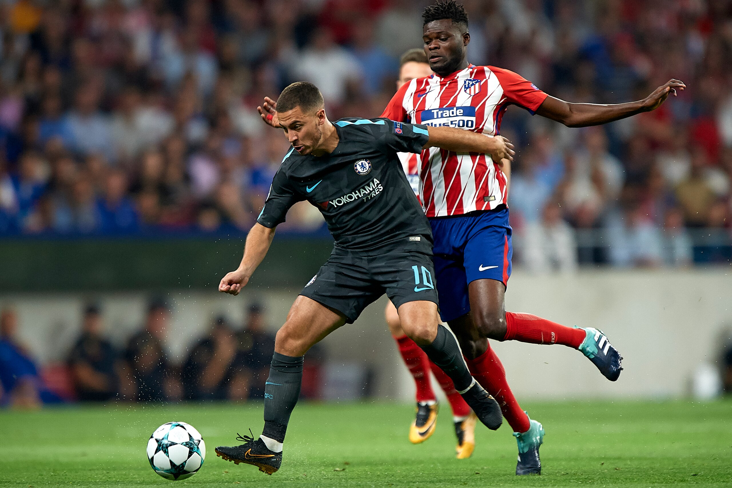 MADRID, SPAIN - SEPTEMBER 27:  Thomas of Atletico de Madrid competes for the ball with Eden Hazard (L) of Chelsea during the UEFA Champions League group C match between Atletico Madrid and Chelsea FC at Vicente Calderon Stadium on September 27, 2017 in Ma