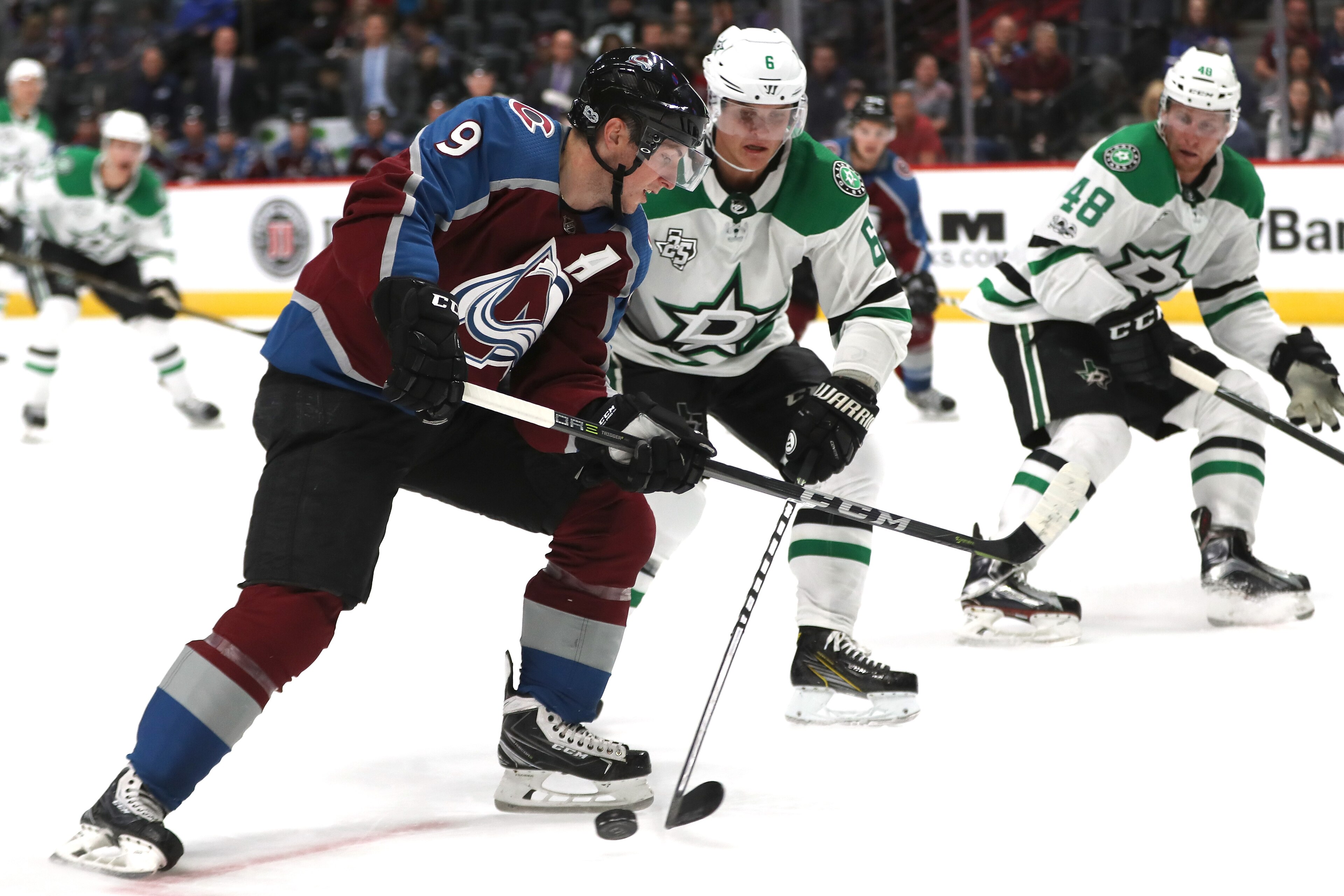 DENVER, CO - SEPTEMBER 21:  Matt Duchene #9 of the Colorado Avalanche fights for control of the puck against Julius Honka #6 of the Dallas Stars at the Pepsi Center on September 21, 2017 in Denver, Colorado.  (Photo by Matthew Stockman/Getty Images)