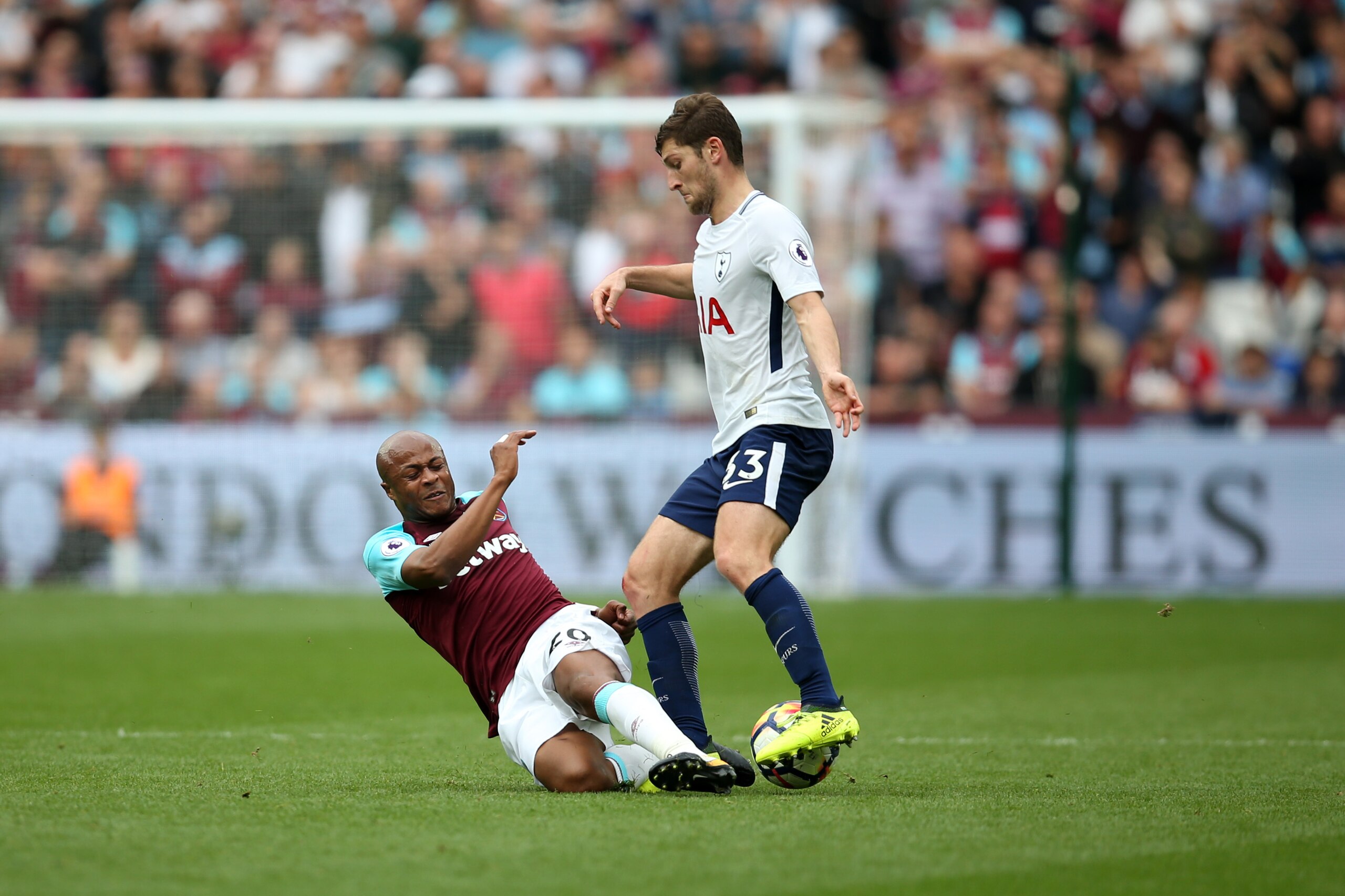 LONDON, ENGLAND - SEPTEMBER 23: Andre Ayew of West Ham United tackles Ben Davies of Tottenham Hotspur during the Premier League match between West Ham United and Tottenham Hotspur at London Stadium on September 23, 2017 in London, England. (Photo by Cathe