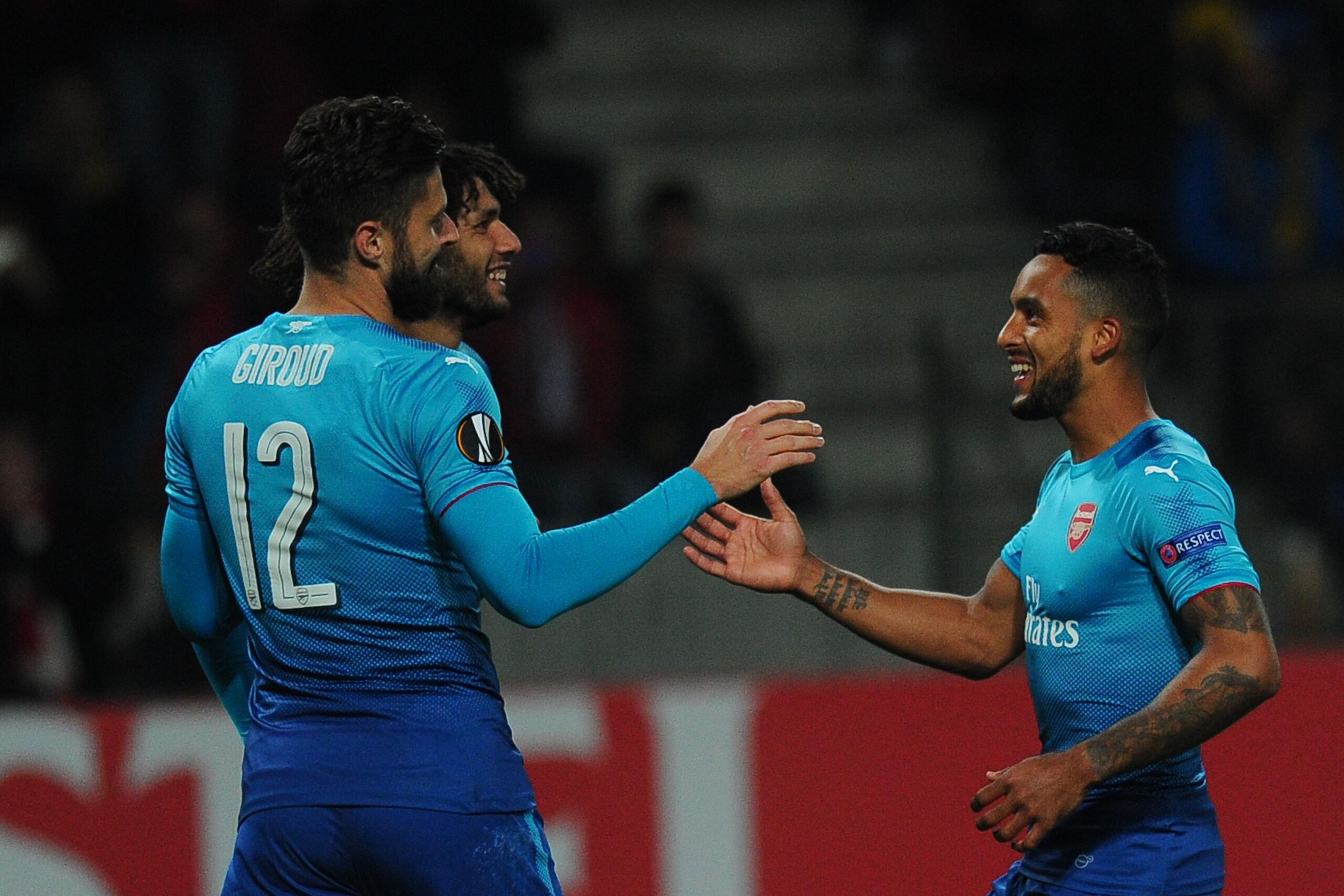 Arsenal's forward from France Olivier Giroud (L) celebrates with teammates after scoring a goal from the penalty spot during the UEFA Europa League Group H football match between FC BATE Borisov and Arsenal FC in Borisov, outside Minsk, on September 28, 2