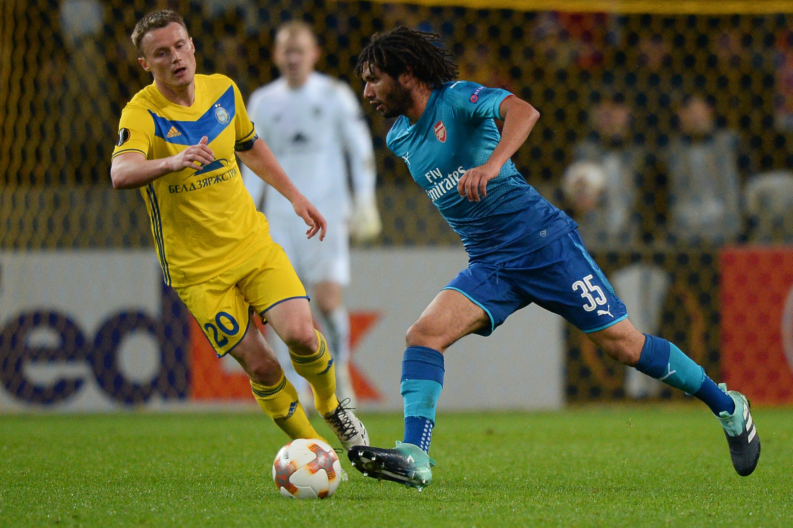 BATE Borisov's forward from Belarus Vitali Rodionov (L) and Arsenal's midfielder from Egypt Mohamed El Neney vie for the ball during the UEFA Europa League Group H football match between FC BATE Borisov and Arsenal FC in Borisov, outside Minsk, on Septemb