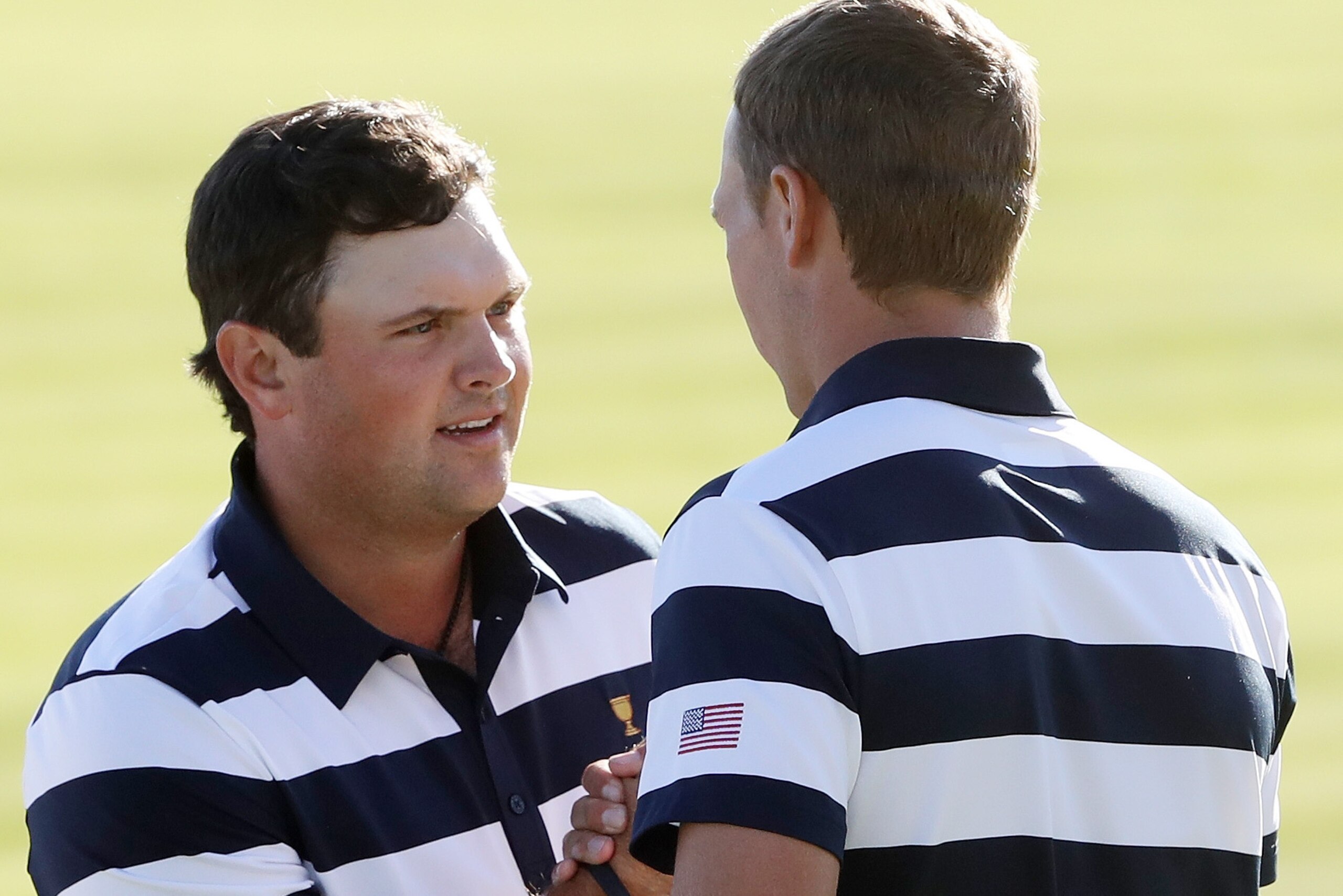 JERSEY CITY, NJ - SEPTEMBER 28:  Patrick Reed and Jordan Spieth of the U.S. Team celebrate defeating Emiliano Grillo of Argentina and the International Team and Si Woo Kim of South Korea and the International Team 5 & 4 on the 14th green during Thursday f