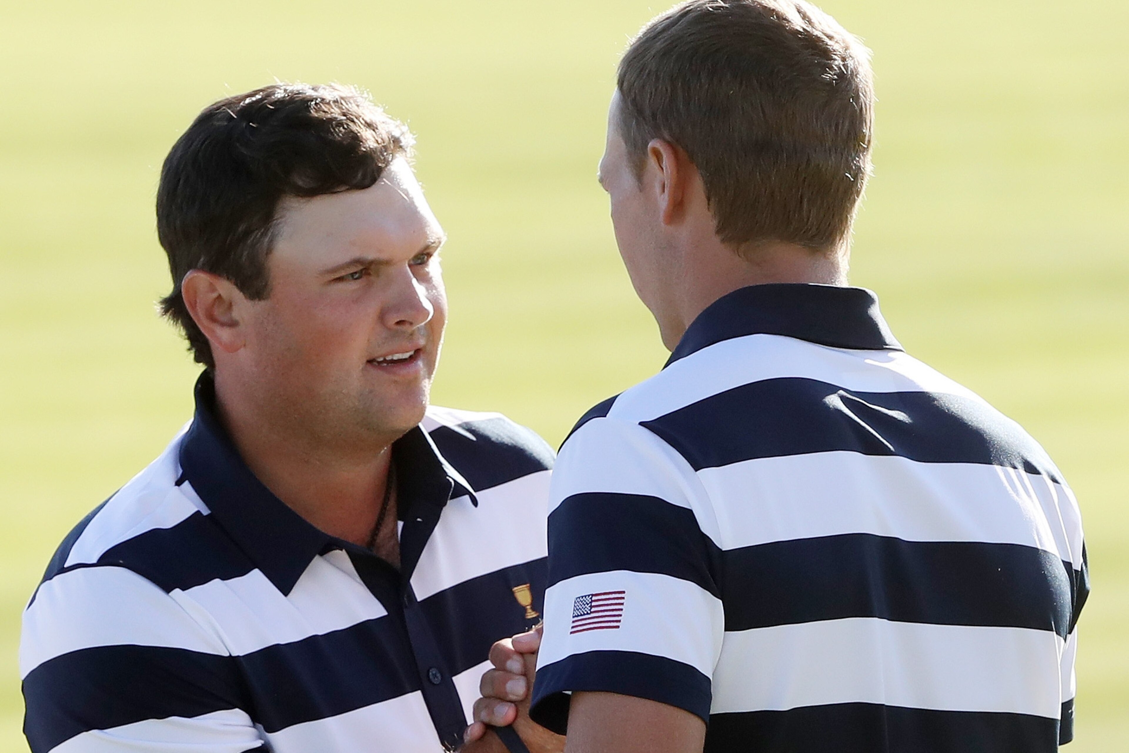 JERSEY CITY, NJ - SEPTEMBER 28: Patrick Reed and Jordan Spieth of the U.S. Team celebrate defeating Emiliano Grillo of Argentina and the International Team and Si Woo Kim of South Korea and the International Team 5 & 4 on the 14th green during Thursday f JERSEY CITY, NJ - SEPTEMBER 28: Patrick Reed and Jordan Spieth of the U.S. Team celebrate defeating Emiliano Grillo of Argentina and the International Team and Si Woo Kim of South Korea and the International Team 5 & 4 on the 14th green during Thursday f