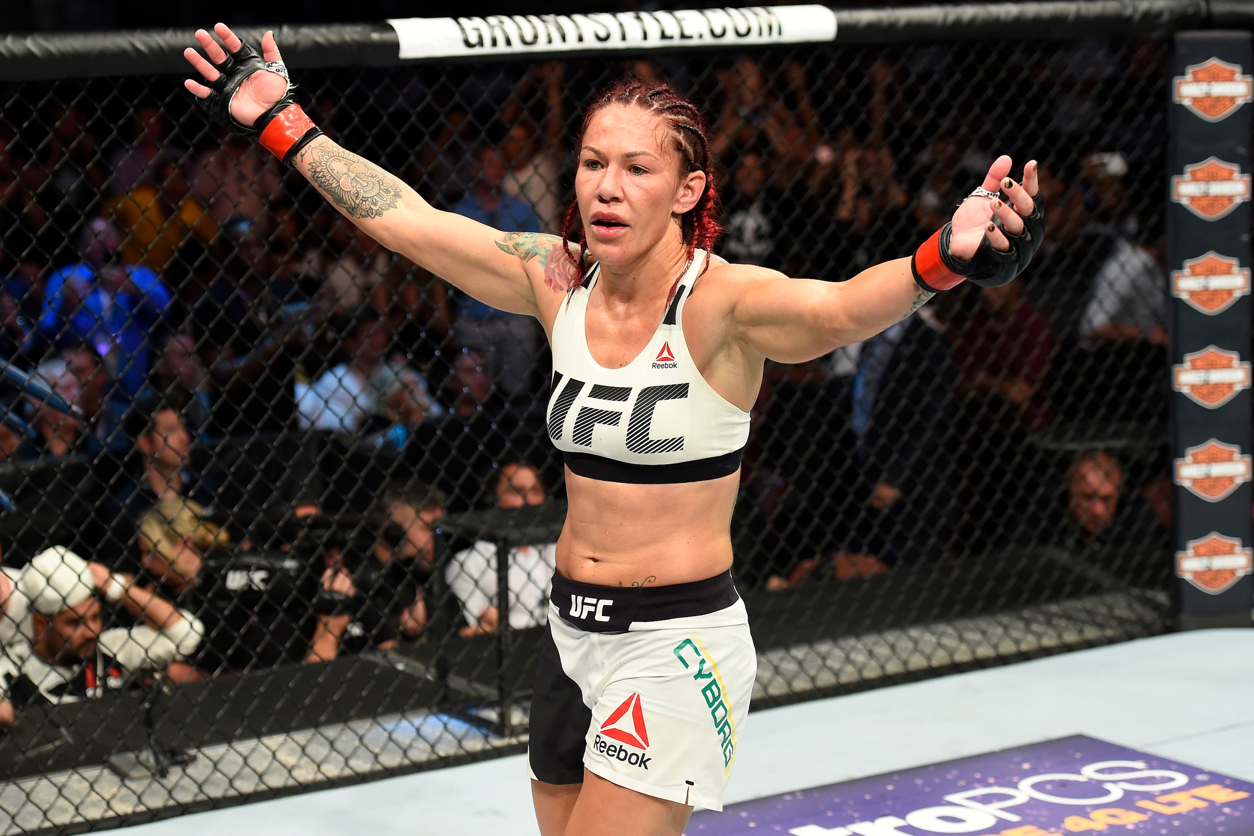 ANAHEIM, CA - JULY 29:  Cris Cyborg of Brazil celebrates after defeating Tonya Evinger in their UFC women's featherweight championship bout during the UFC 214 event inside the Honda Center on July 29, 2017 in Anaheim, California. (Photo by Josh Hedges/Zuf