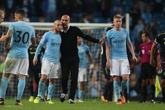MANCHESTER, ENGLAND - AUGUST 21: David Silva of Manchester City gets praised by Pep Guardiola the head coach / manager of Manchester City at the end of the Premier League match between Manchester City and Everton at Etihad Stadium on August 21, 2017 in Ma