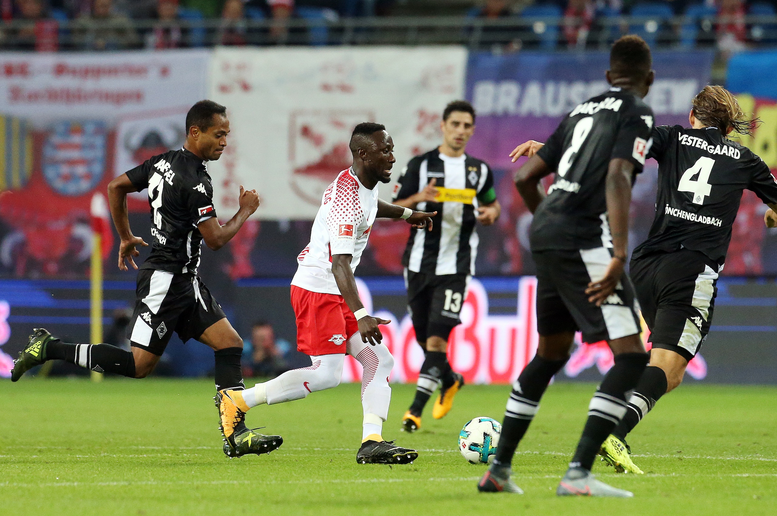 LEIPZIG, GERMANY - SEPTEMBER 16: Raffael of Moenchengladbach and Naby Keita of Leipzig battle for the ball during the Bundesliga match between RB Leipzig and Borussia Moenchengladbach at Red Bull Arena on September 16, 2017 in Leipzig, Germany. (Photo by 
