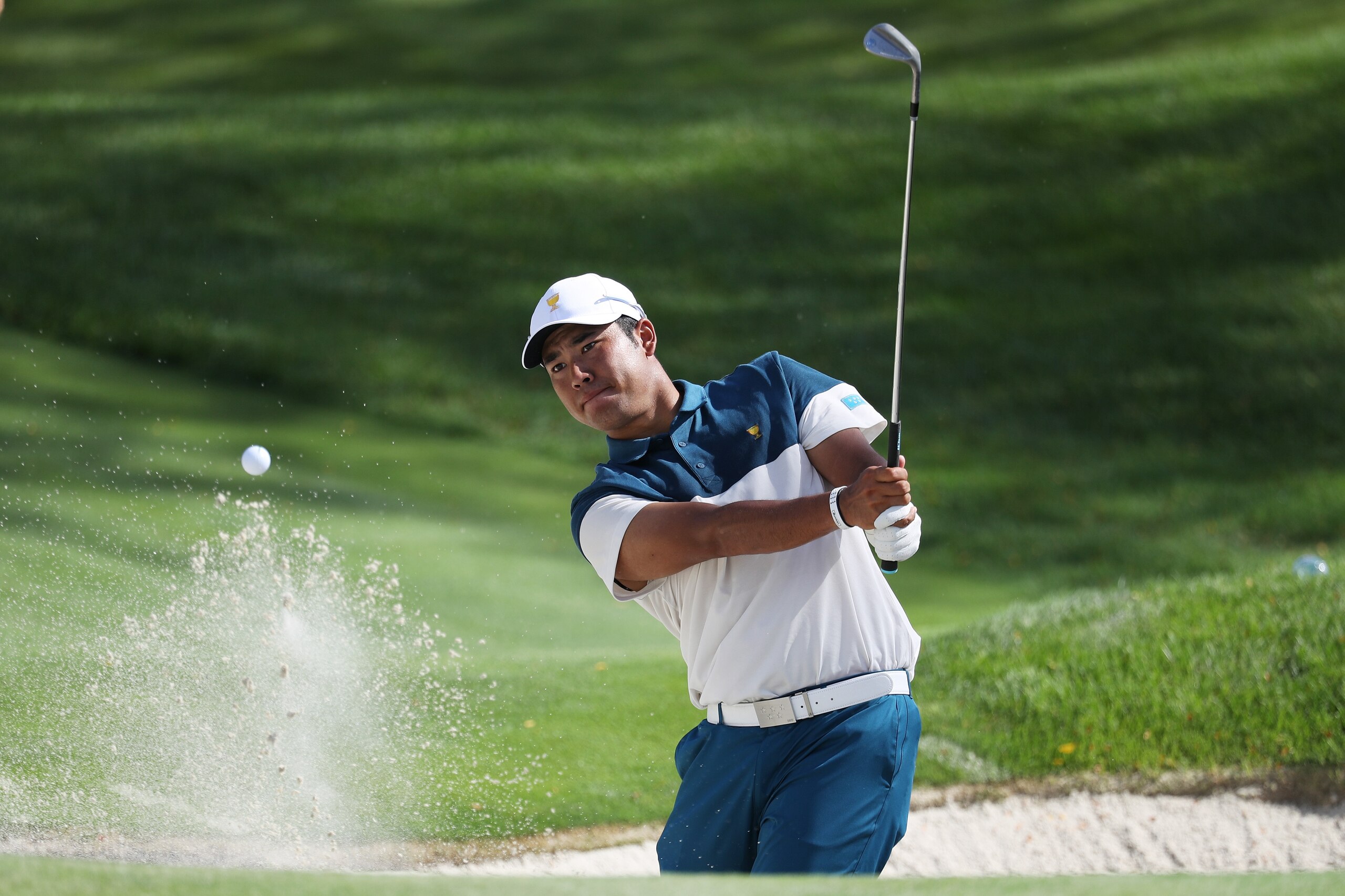 JERSEY CITY, NJ - SEPTEMBER 27:  Hideki Matsuyama of Japan and the International Team plays a shot from a bunker during practice rounds prior to the Presidents Cup at Liberty National Golf Club on September 27, 2017 in Jersey City, New Jersey.  (Photo by 