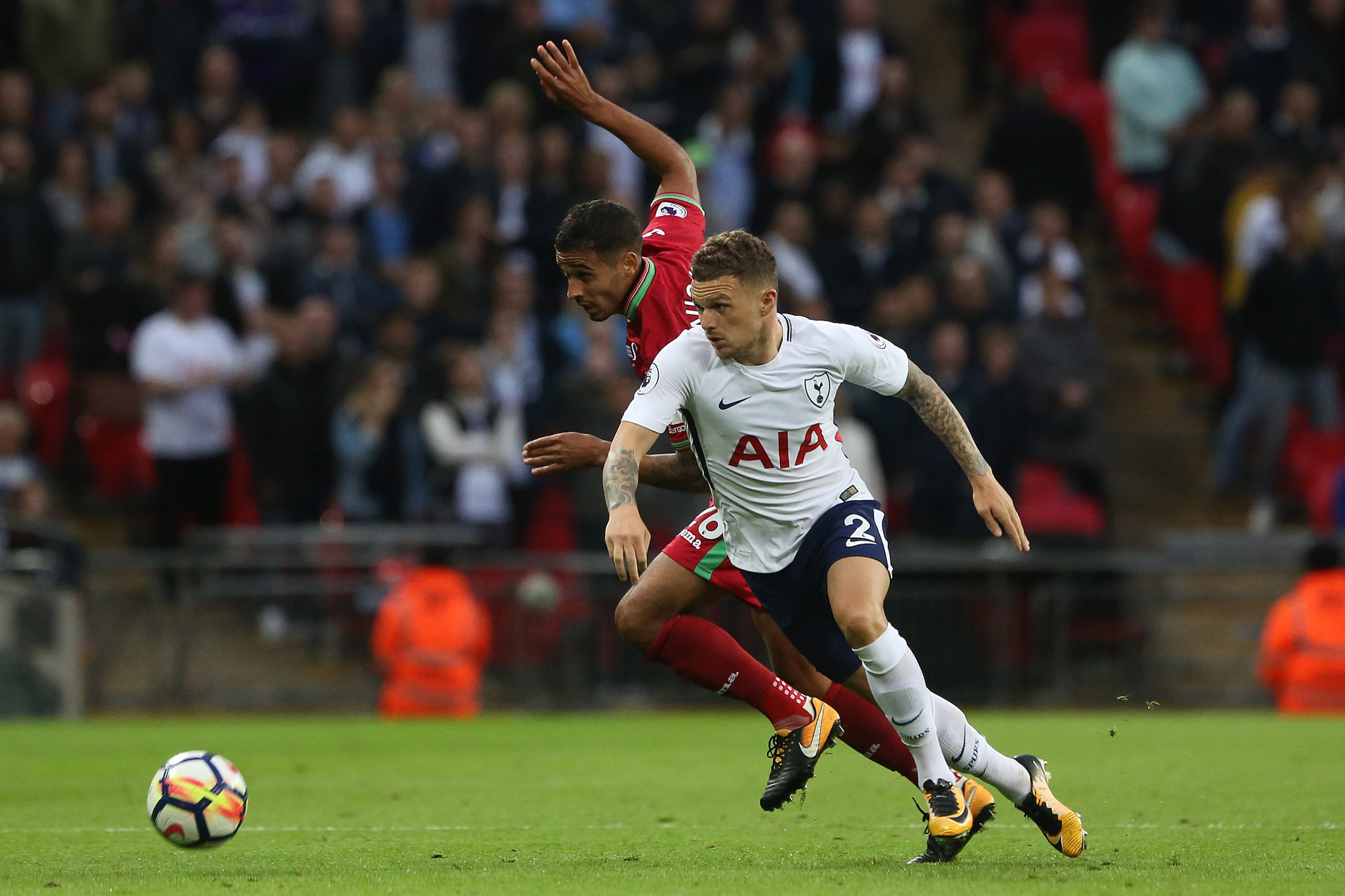 LONDON, ENGLAND - SEPTEMBER 16: Kyle Naughton of Swansea City challenges Kieran Trippier of Tottenham Hotspur during the Premier League match between Tottenham Hotspur and Swansea City at Wembley Stadium on September 16, 2017 in London, England. (Photo by