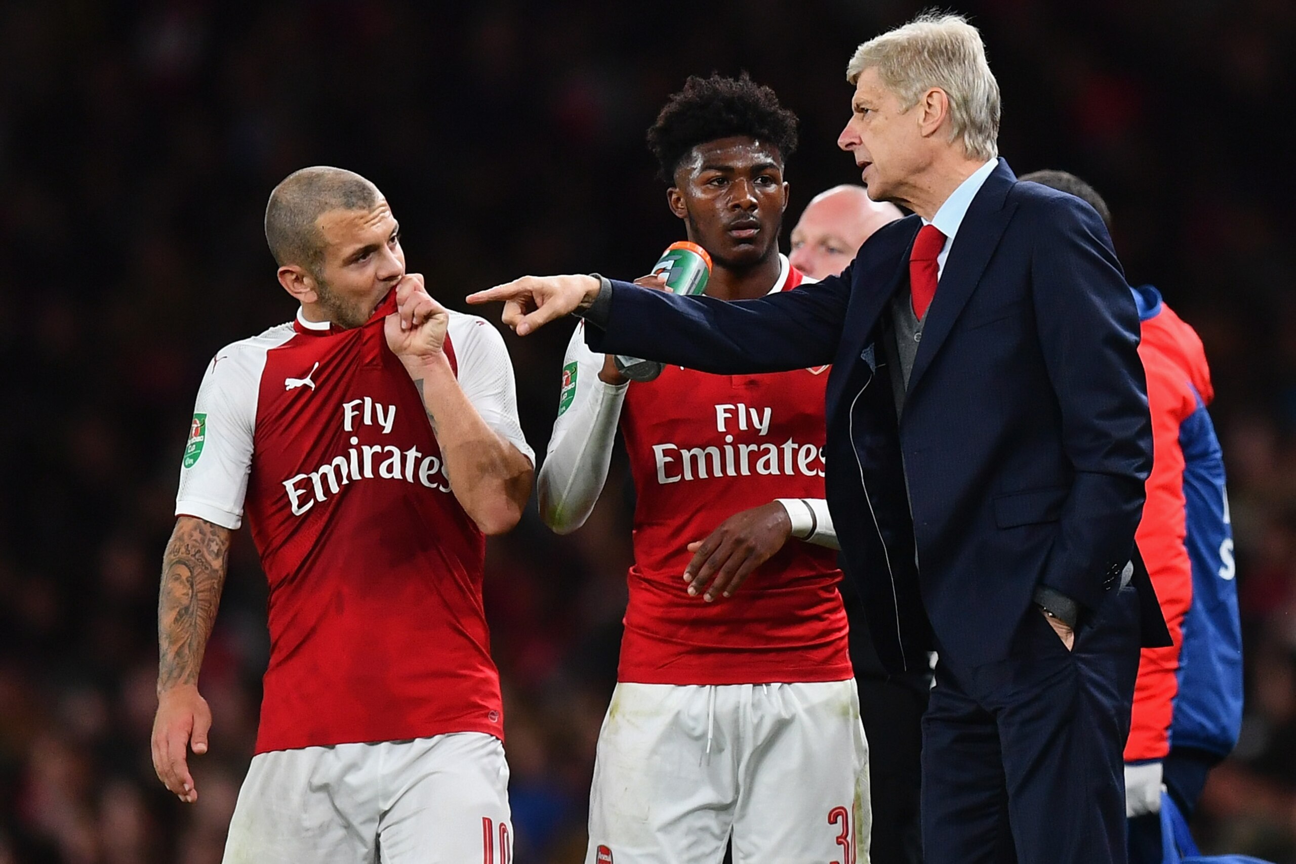 LONDON, ENGLAND - SEPTEMBER 20: Arsene Wenger, Manager of Arsenal speaks to Jack Wilshere of Arsenal during the Carabao Cup Third Round match between Arsenal and Doncaster Rovers at Emirates Stadium on September 20, 2017 in London, England.  (Photo by Dan