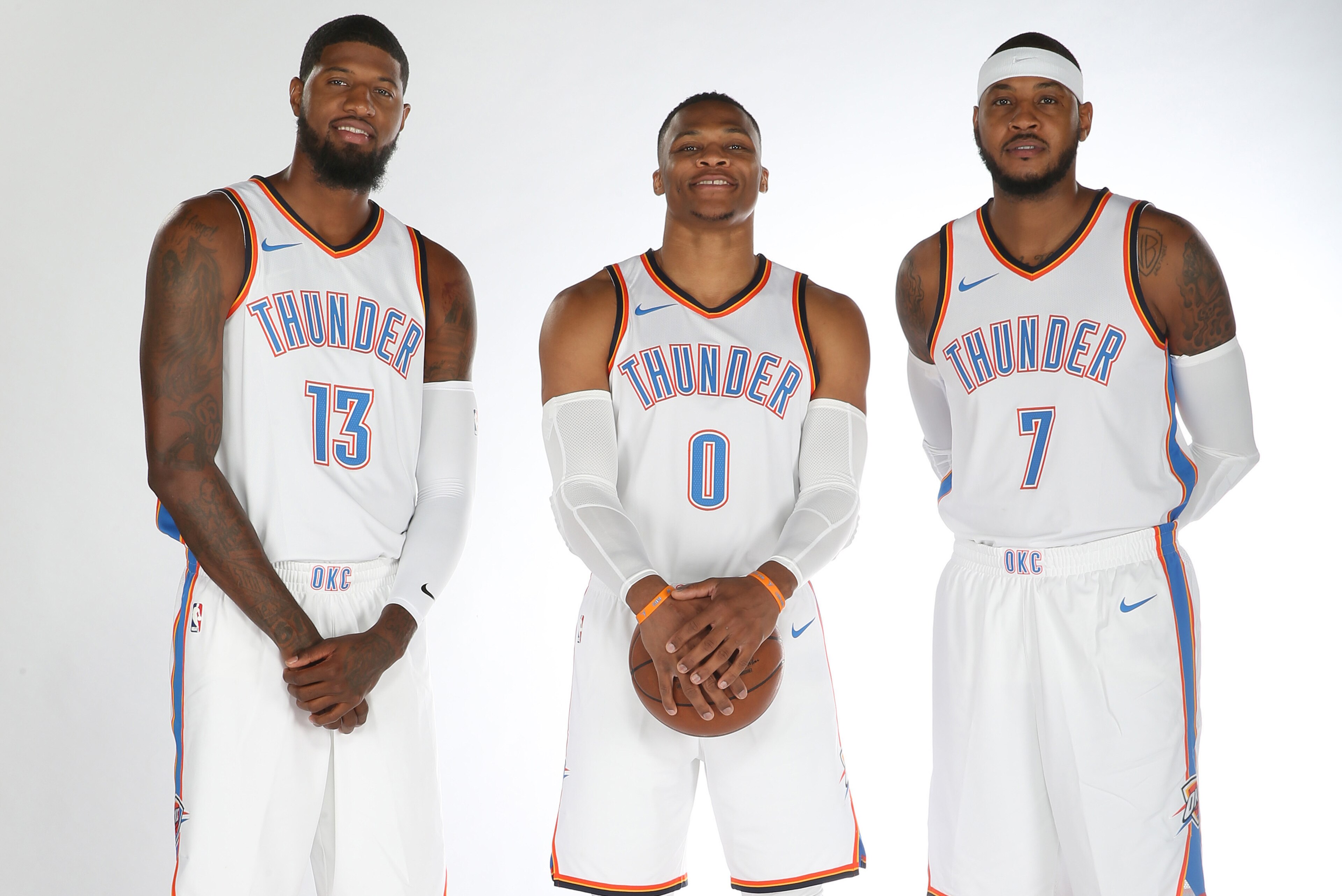 OKLAHOMA CITY, OK - SEPTEMBER 25: Paul George #13, Russell Westbrook #0 and Carmelo Anthony #7 of the Oklahoma City Thunder pose for a portrait during the 2017 NBA Media Day on September 25, 2017 at the Chesapeake Energy Arena in Oklahoma City, Oklahoma. 