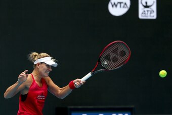 BEIJING, CHINA - SEPTEMBER 30:  Angelique Kerber of Germany returns a shot to Naomi Osaka of japan on day one of the 2017 China Open at the China National Tennis Centre on September 30, 2017 in Beijing, China.  (Photo by Emmanuel Wong/Getty Images)