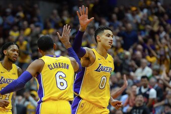ANAHEIM, CA - SEPTEMBER 30:  Kyle Kuzma #0 of the Los Angeles Lakers celebrates with his teamate Jordan Clarkson #6 during the game against the Minnesota Timberwolves on September 30, 2017 at the Honda Center in Anaheim, California. NOTE TO USER: User exp