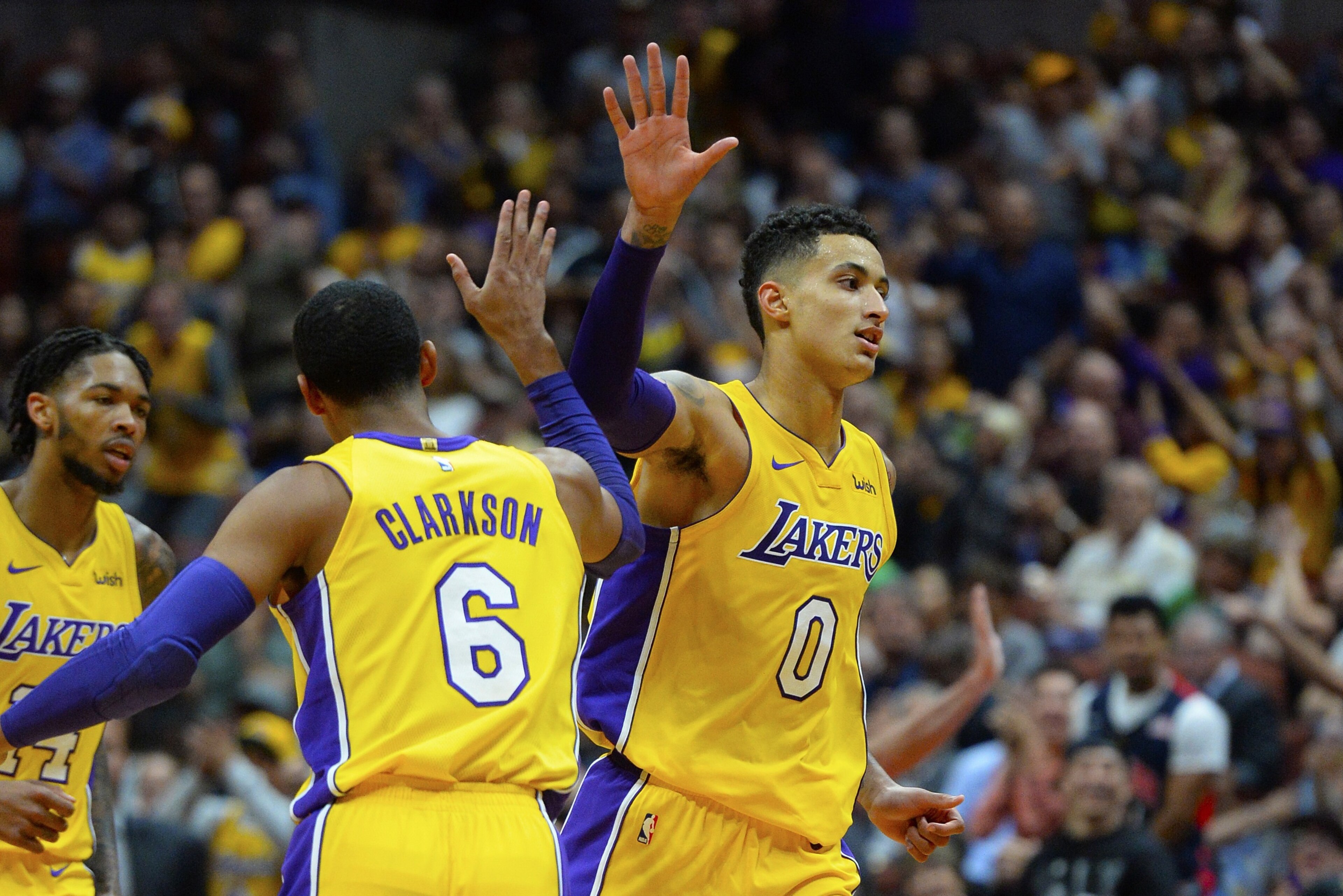 ANAHEIM, CA - SEPTEMBER 30:  Kyle Kuzma #0 of the Los Angeles Lakers celebrates with his teamate Jordan Clarkson #6 during the game against the Minnesota Timberwolves on September 30, 2017 at the Honda Center in Anaheim, California. NOTE TO USER: User exp