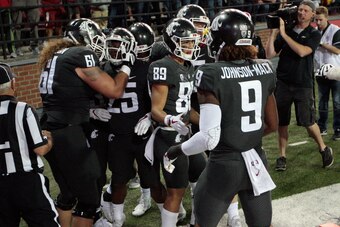 PULLMAN, WA - SEPTEMBER 29:  The Washington State Cougars celebrate with Jamal Morrow #25 after his touchdown in the second half of the game against the USC Trojans at Martin Stadium on September 29, 2017 in Pullman, Washington.  Washington State defeated