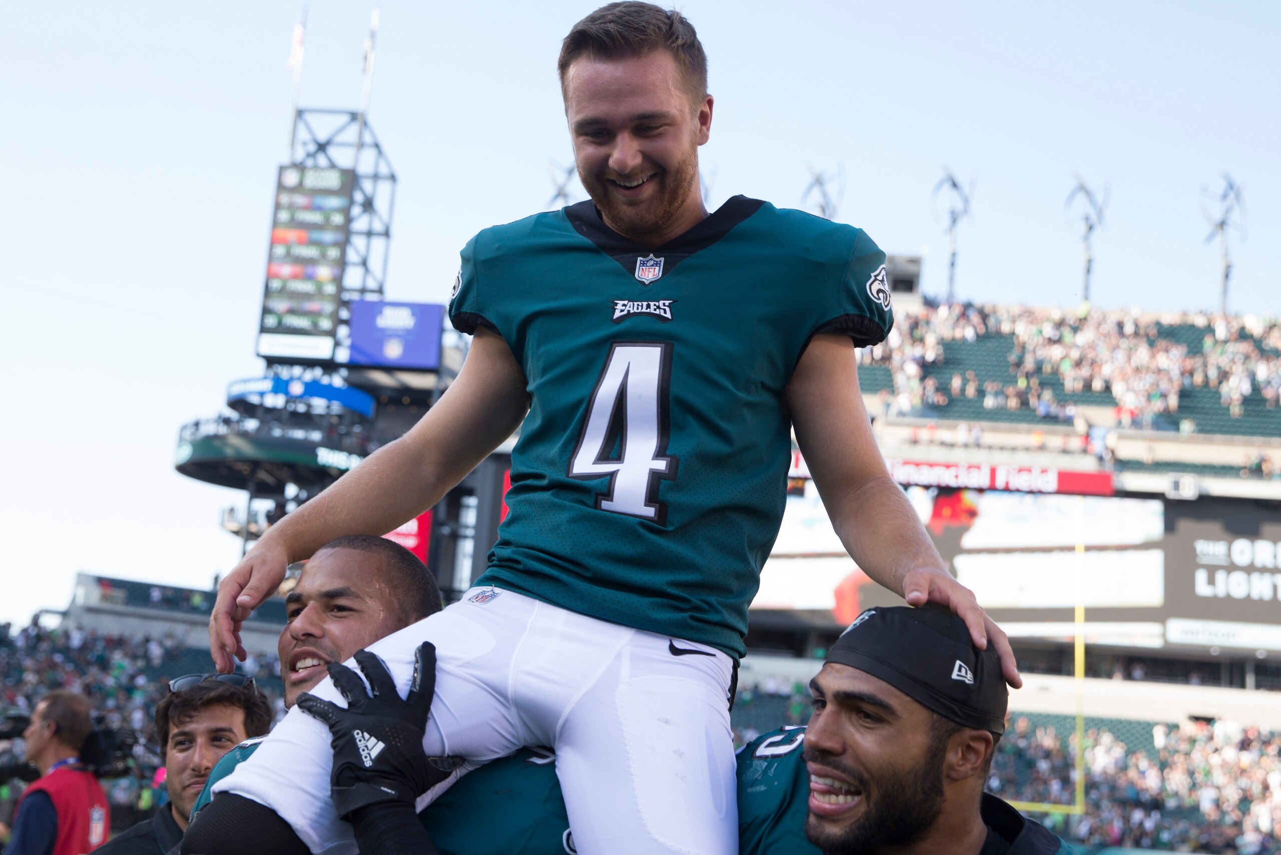 PHILADELPHIA, PA - SEPTEMBER 24: Kamu Grugier-Hill #54 and Mychal Kendricks #95 of the Philadelphia Eagles carry Jake Elliott #4 of the Philadelphia Eagles off the field after the game against the New York Giants at Lincoln Financial Field on September 24