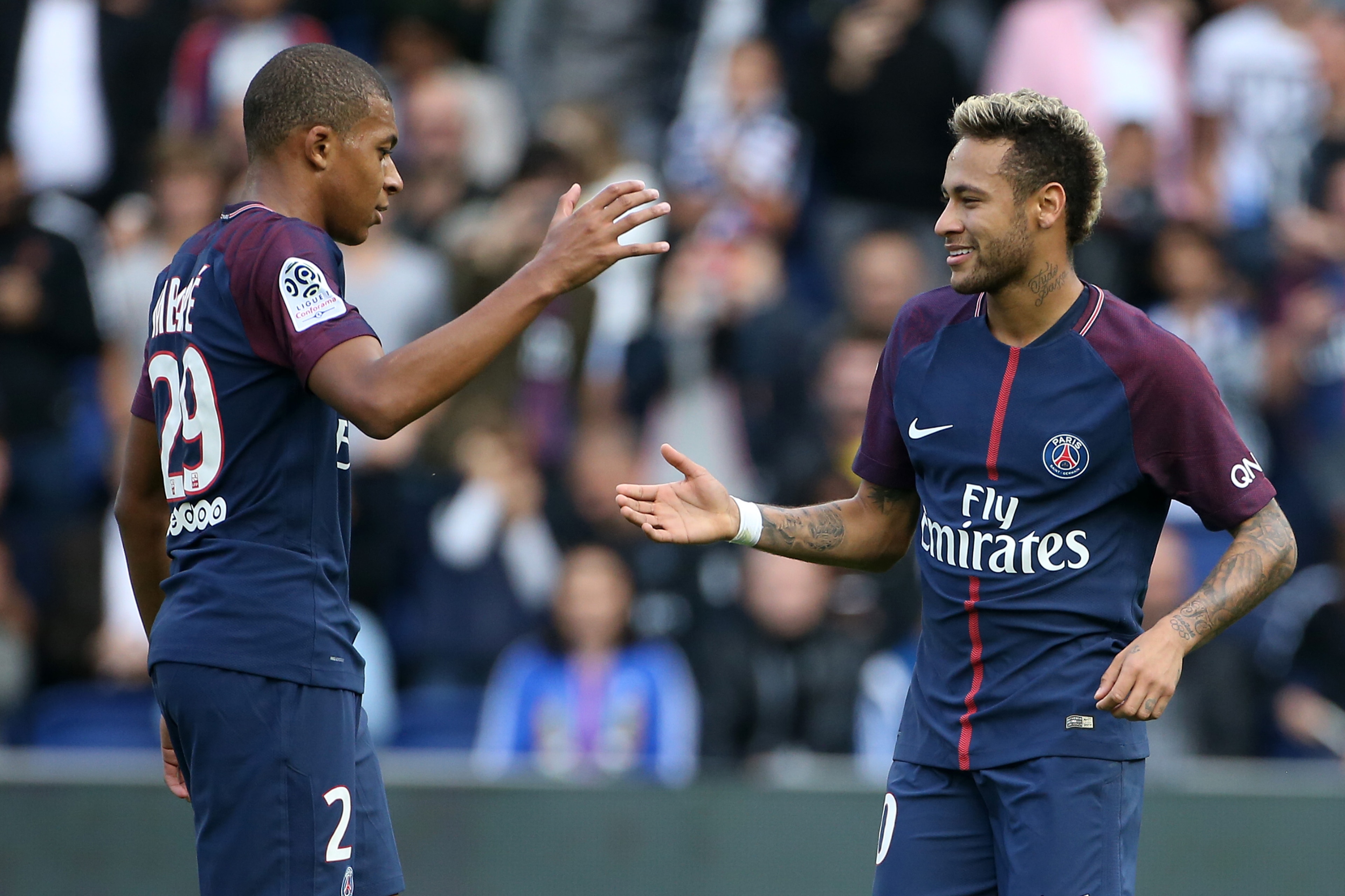 PARIS, FRANCE - SEPTEMBER 30: Neymar Jr of PSG celebrates his second goal with Kylian Mbappe (left) during the French Ligue 1 match between Paris Saint-Germain (PSG) and FC Girondins de Bordeaux at Parc des Princes on September 30, 2017 in Paris, France. 