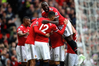 MANCHESTER, ENGLAND - SEPTEMBER 30:  Romelu Lukaku (top) of Manchester United joins the celebration as Marouane Fellaini (2nd L) of Manchester United scroing his side's third goal during the Premier League match between Manchester United and Crystal Palac