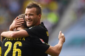 Dortmund's Polish defender Lukasz Piszcek (L) and Dortmund's Ukrainian striker Andrey Yarmolenko (R) celebrate after scoring the first goal during the German first division Bundesliga football match between FC Augsburg and Borussia Dortmund in Augsburg, s