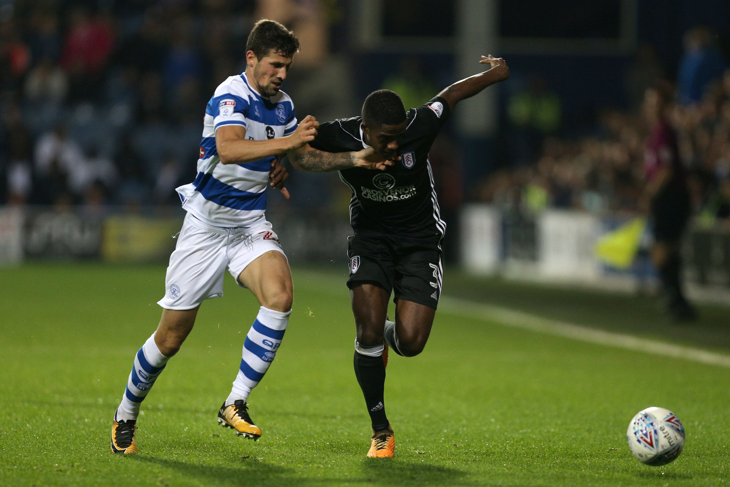 LONDON, ENGLAND - SEPTEMBER 29: Pawel Wszolek of Queens Park Rangers and Ryan Sessegnon of Fulham battle for possession during the Sky Bet Championship match between Queens Park Rangers and Fulham at Loftus Road on September 29, 2017 in London, England. LONDON, ENGLAND - SEPTEMBER 29: Pawel Wszolek of Queens Park Rangers and Ryan Sessegnon of Fulham battle for possession during the Sky Bet Championship match between Queens Park Rangers and Fulham at Loftus Road on September 29, 2017 in London, England.