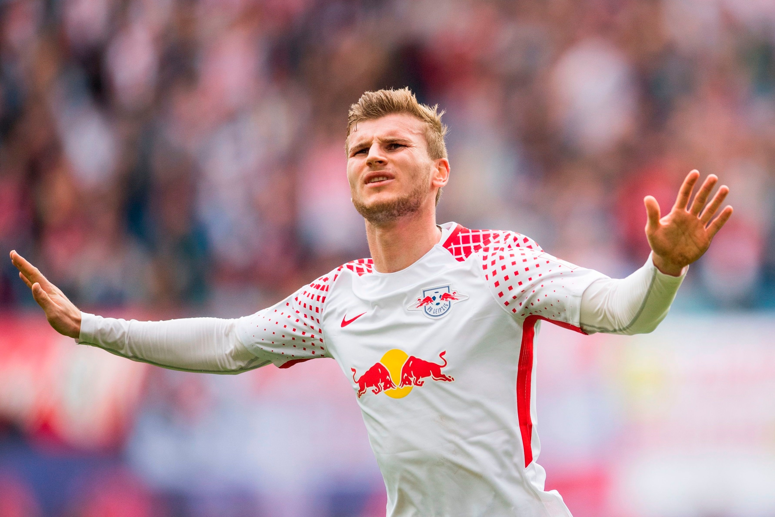 Leipzig´s forward Timo Werner celebrates scoring during the German dirst division Bundesliga football match between RB Leipzig and Eintracht Frankfurt in Leipzig, eastern Germany, on September 23, 2017. / AFP PHOTO / ROBERT MICHAEL / RESTRICTIONS: DURING 