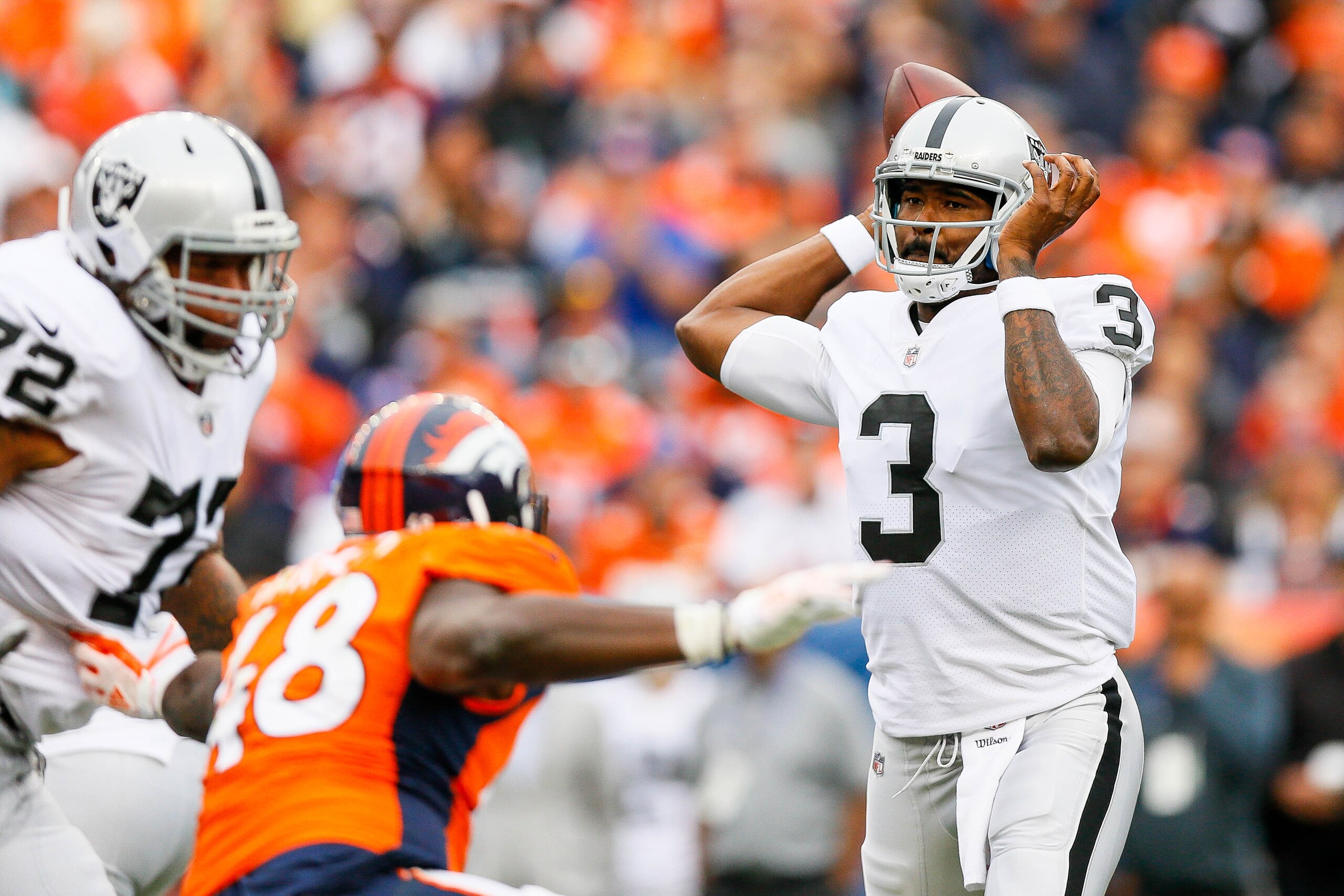 DENVER, CO - OCTOBER 1:  Quarterback EJ Manuel #3 of the Oakland Raiders looks passes against the Denver Broncos in the third quarter of a game at Sports Authority Field at Mile High on October 1, 2017 in Denver, Colorado. (Photo by Justin Edmonds/Getty I